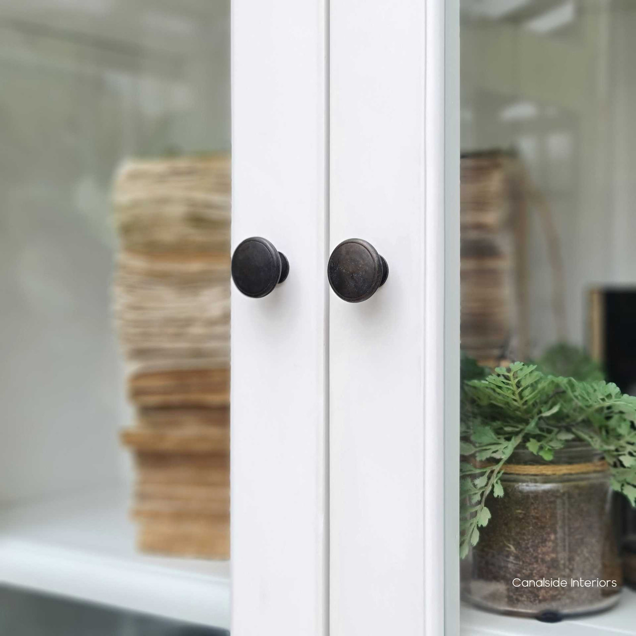 Featuring glass doors and a subtly distressed white finish, the Key Largo Display Unit is a testament to timeless elegance for the home