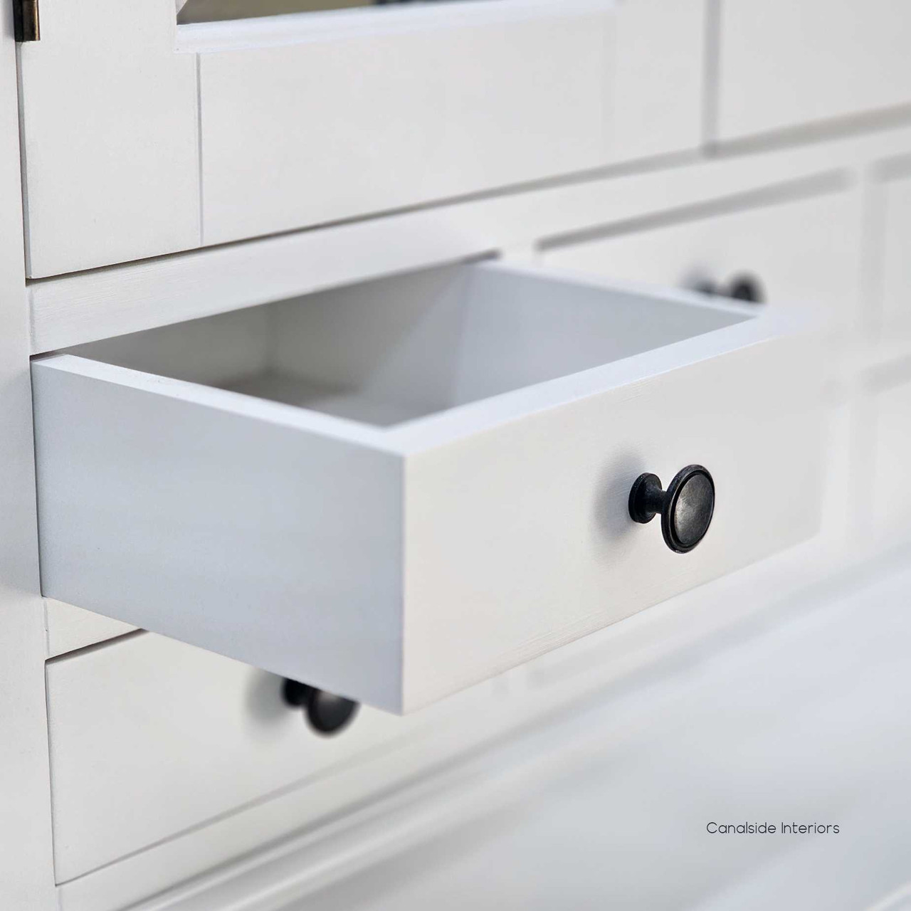Detail shot of the small upper drawers, ideal for organising everyday items or décor accessories.