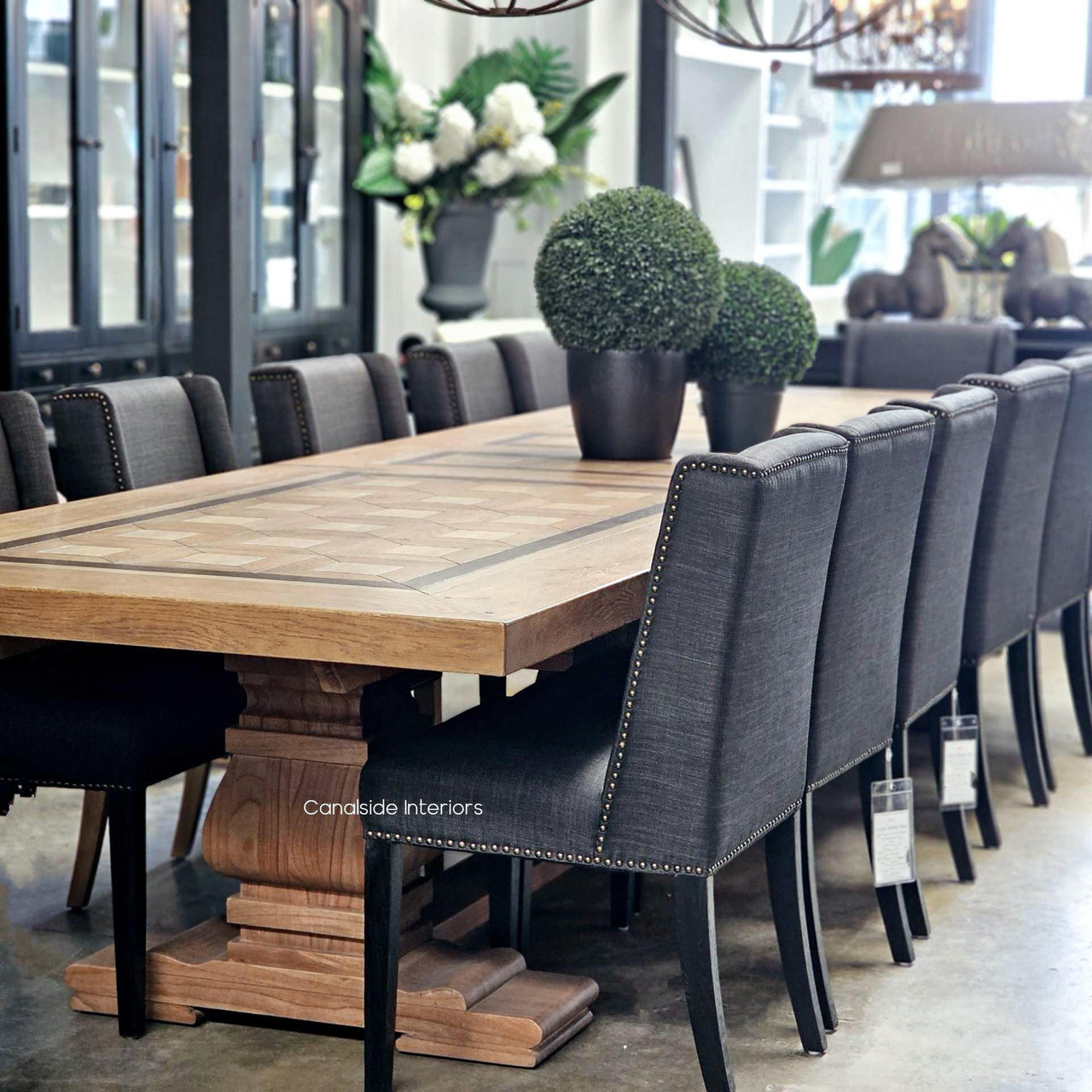 Wide shot of the 3.5m Chambers extension dining table partially extended for a mid-sized gathering.