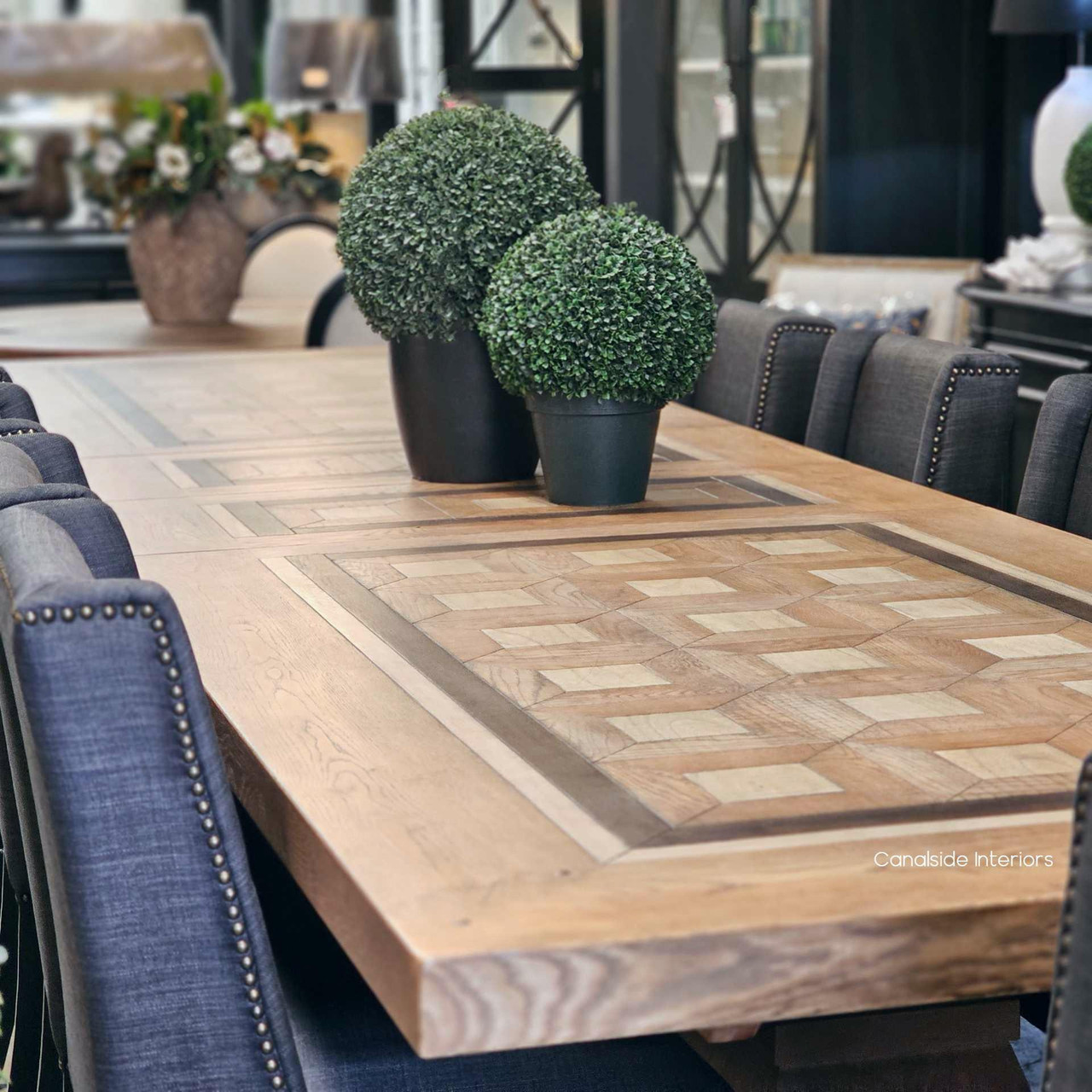 Aerial view of the 3.5m extendable dining table styled with chairs in a formal dining space.