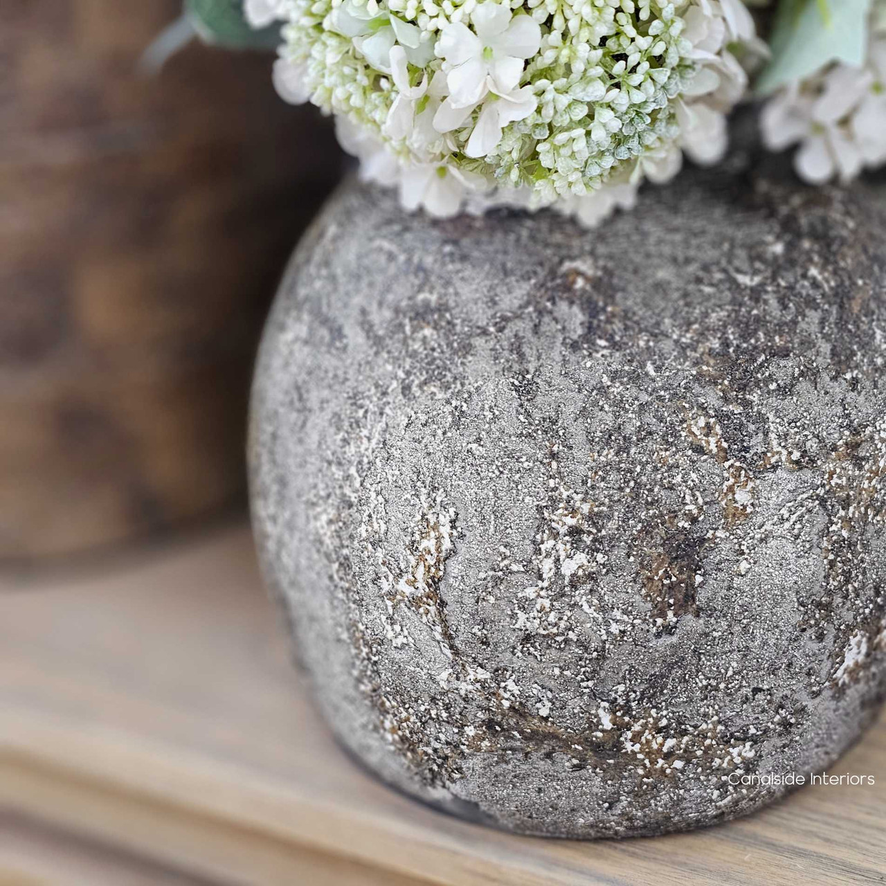 Close-up of the Malara vessel’s mineral-washed finish, showing the richly textured, stone-like surface.