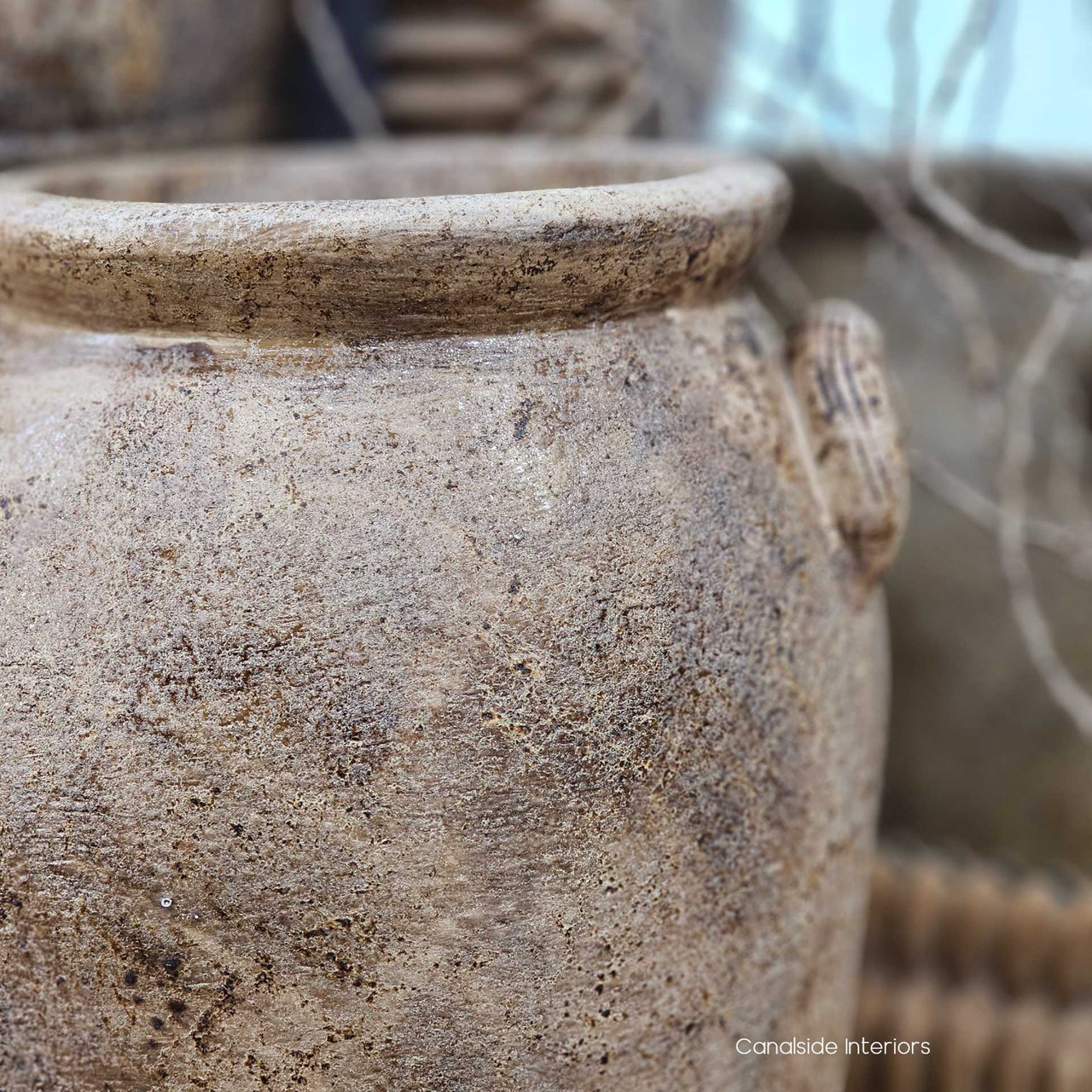 Detail shot of the Sekar’s stonewashed clay surface, with visible pitting and patina variations.