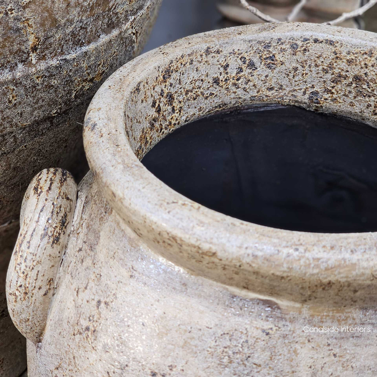 Detailed top-down image of the Sekar pot, drawing out tonal warmth in the clay and highlighting its handcrafted character.