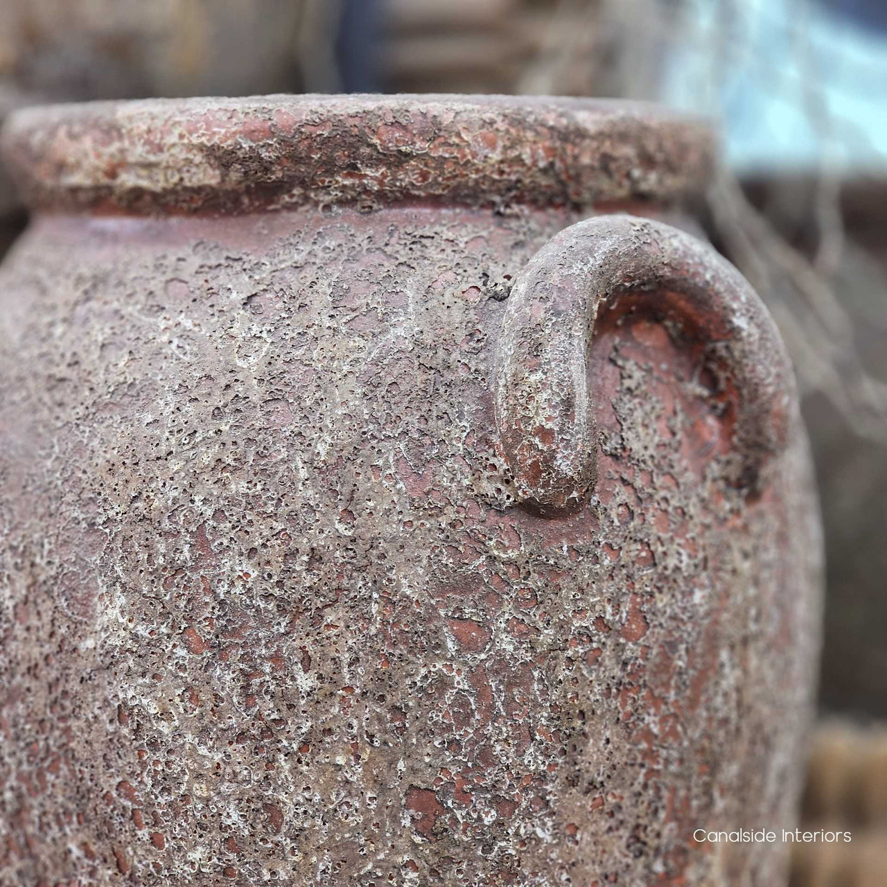 Close-up of one of the Sekar pot’s handles, revealing its handmade detailing and textured surface.
