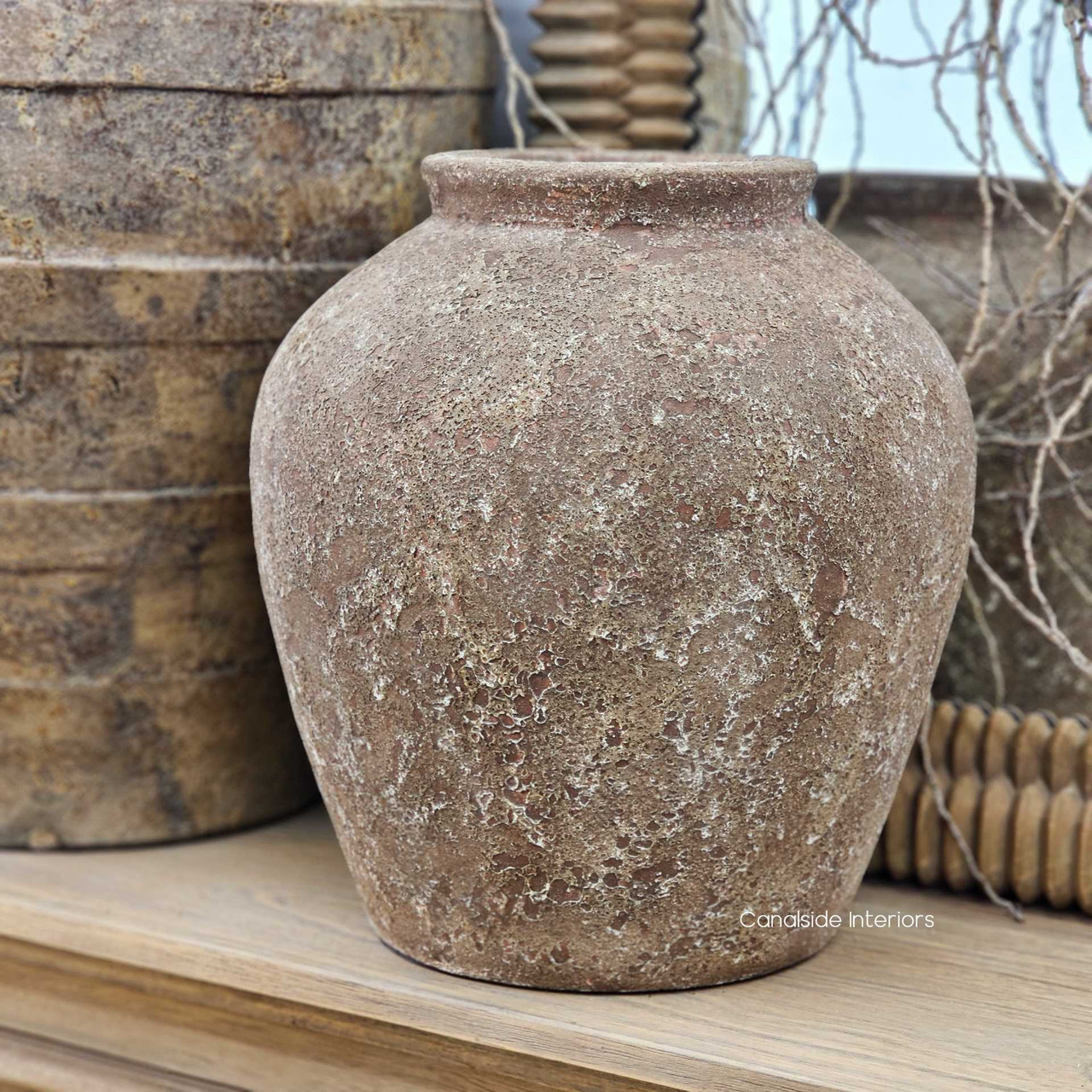 Ayara small pot in a vignette with larger vessels, creating a balanced, textural display.