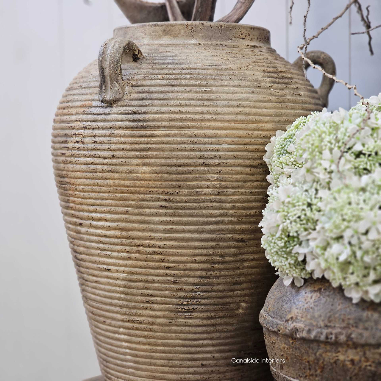 Side view of the Lirien vessel’s curved silhouette and twin looped handles, showing its balance of sculptural form and rustic charm.