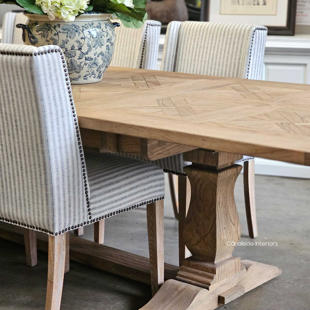 Full frontal view with chairs slightly pulled back, showing proportion and design symmetry.