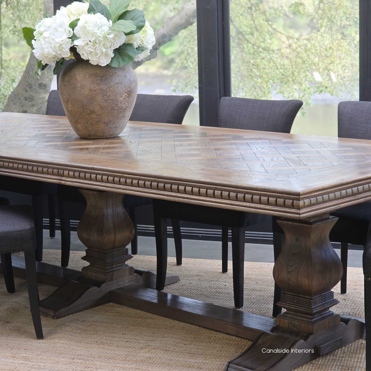 Classic dining room featuring the Berenson Oak Parquetry 320cm Extendable Dining Table in Cigar finish set for a formal banquet.