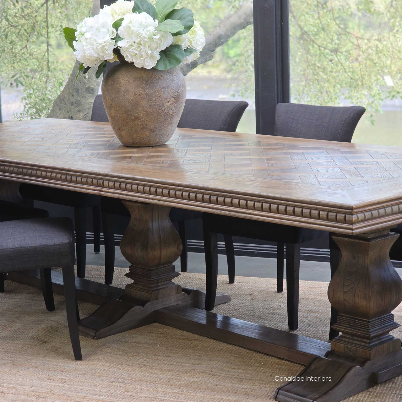 Pedestal base craftsmanship detail on Berenson banquet dining table in Cigar.