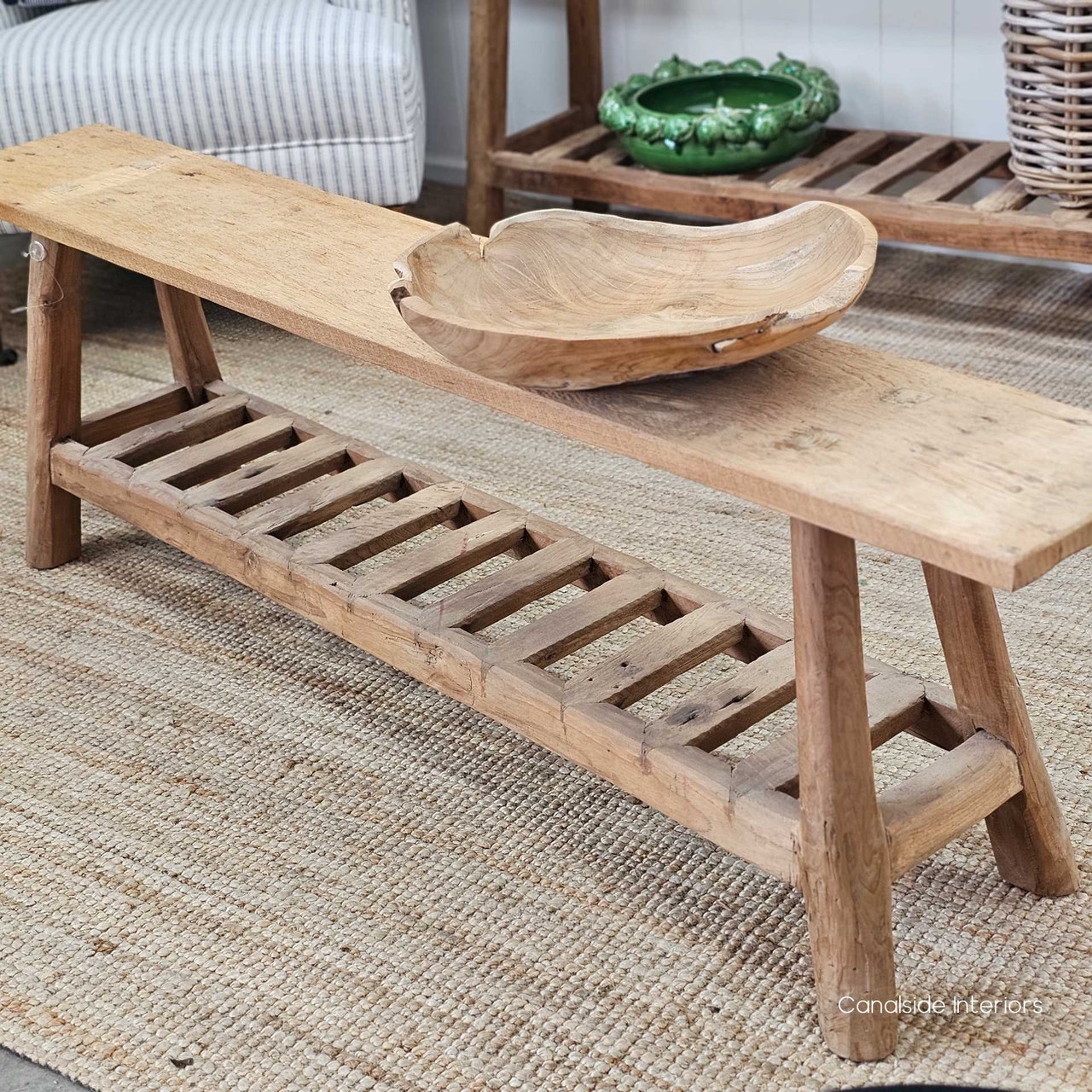 Understated elegance of the Vintage Teak Bench in a neutral setting, emphasising its versatility and functional lower shelf.