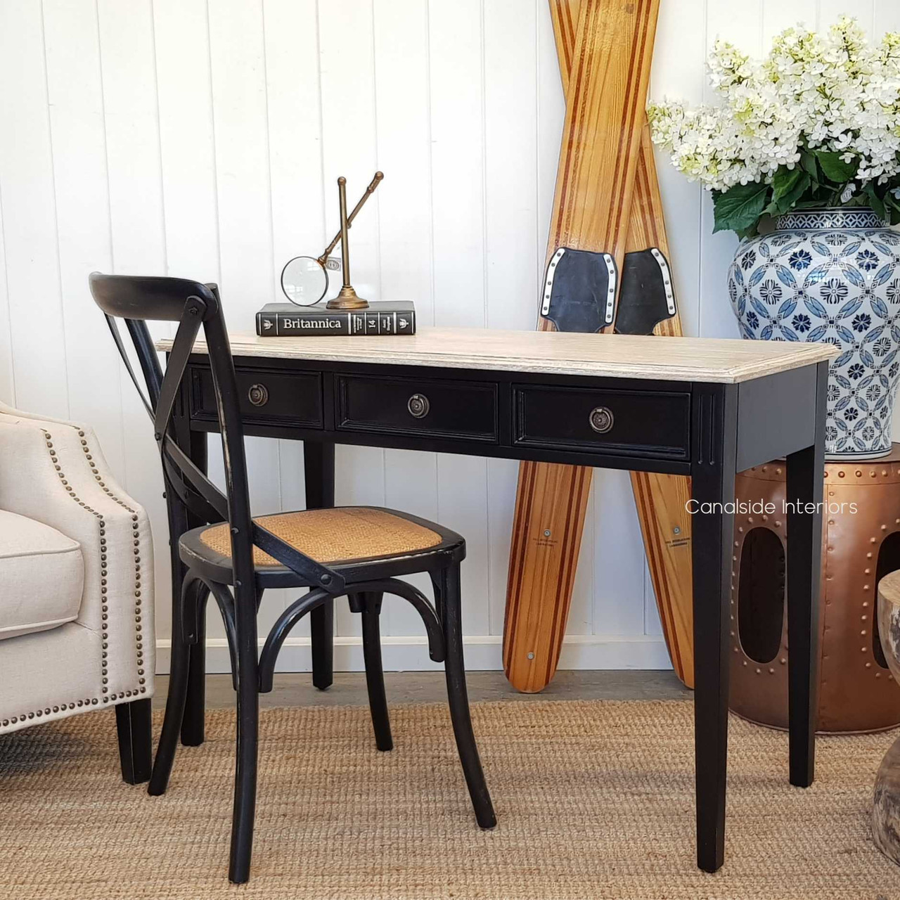 View of the Peninsula Desk/Console in black with a limewash top, showcasing its versatility and elegant design in a Hamptons-inspired setting.