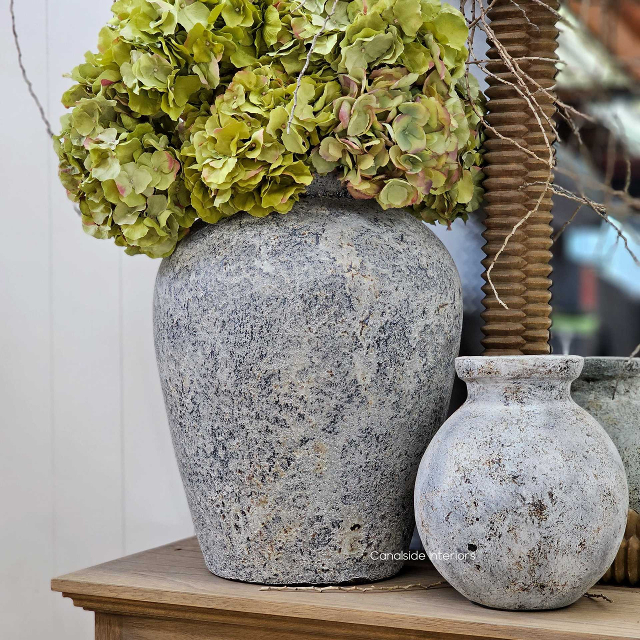 Angled view of the Ayara Vessel in stonewash finish showcasing its tapered silhouette and textured stone surface.