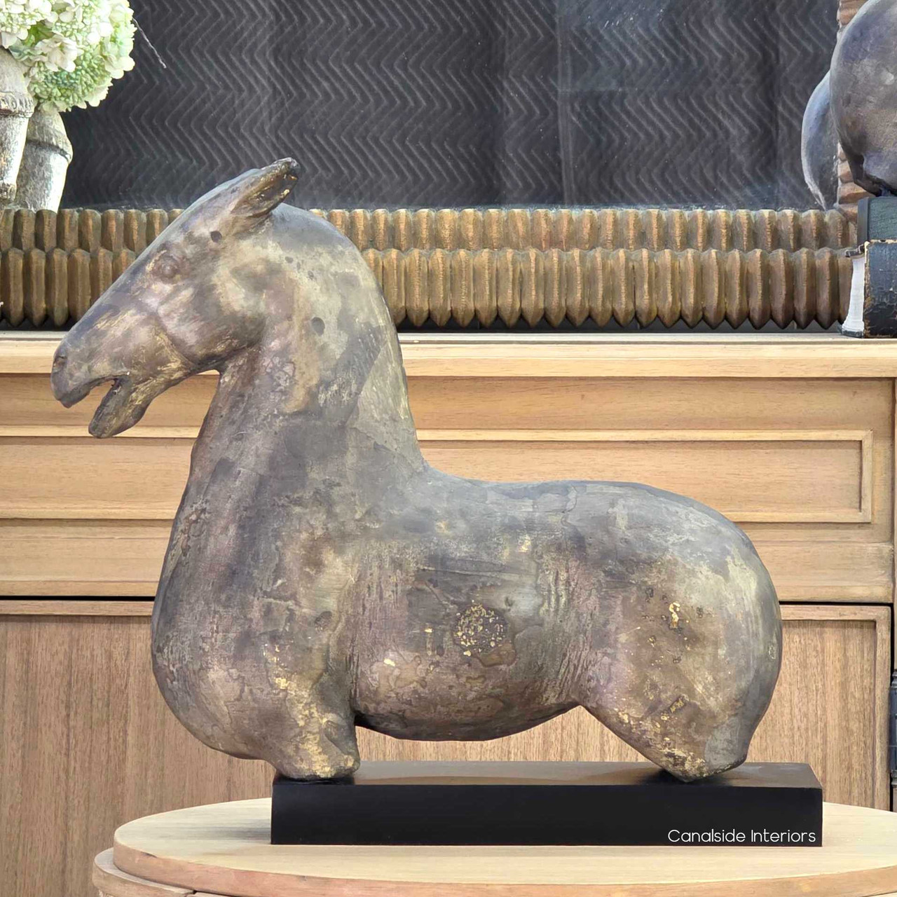 Straight close-up capturing the rich depth of colour, natural variations, and artisanal hand-finishing of the concrete surface.