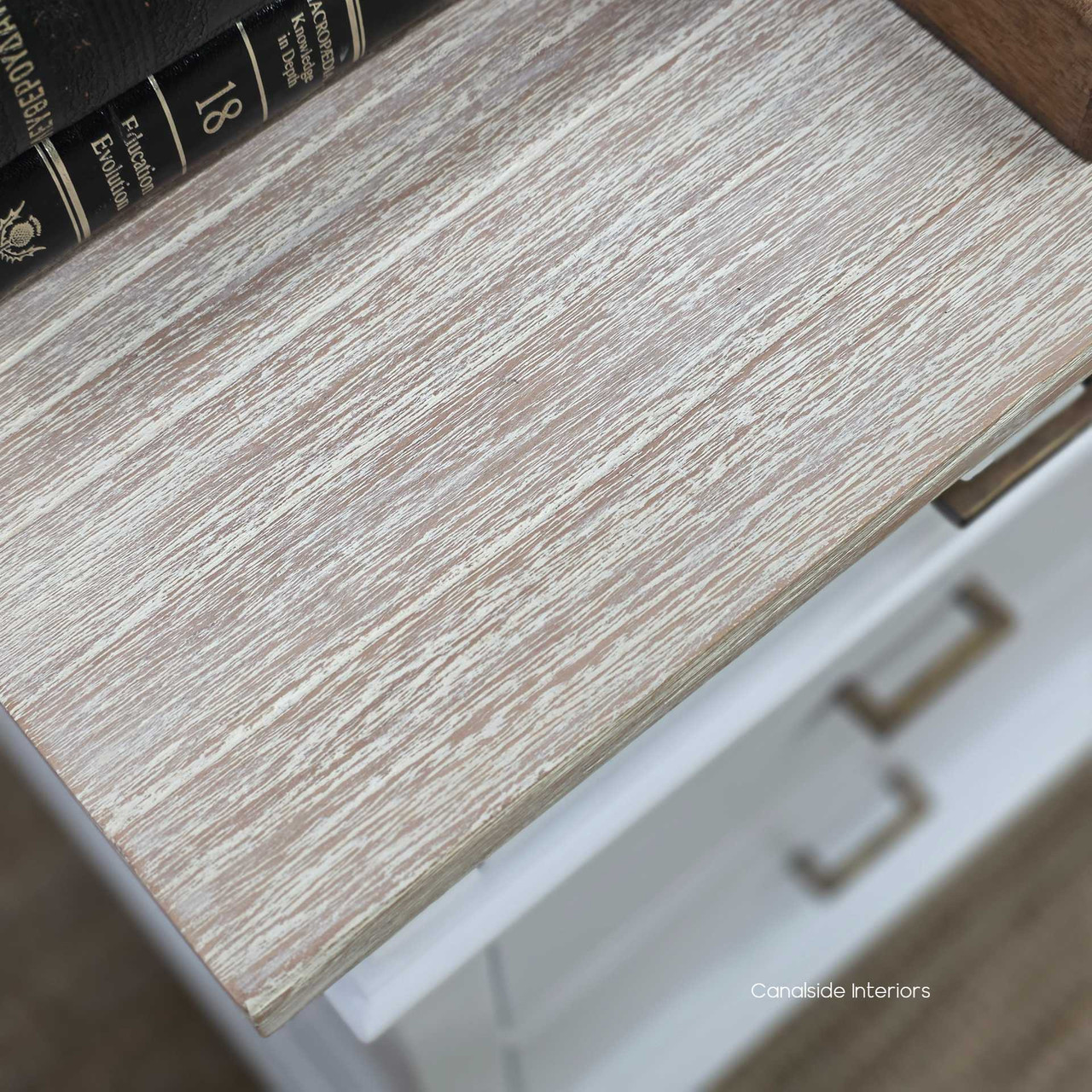 Top-down view of the Berry Court bedside in white, highlighting the softly limewashed timber surface with natural grain variation and gently weathered patina.