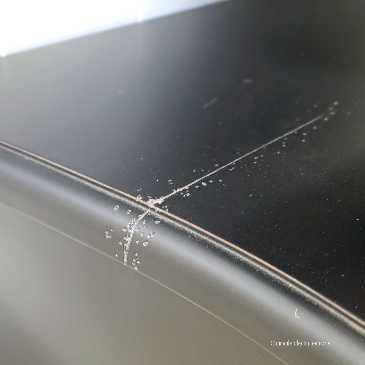 Zoomed-in image showing the purposeful distressing, soft patina and aged colour variation.