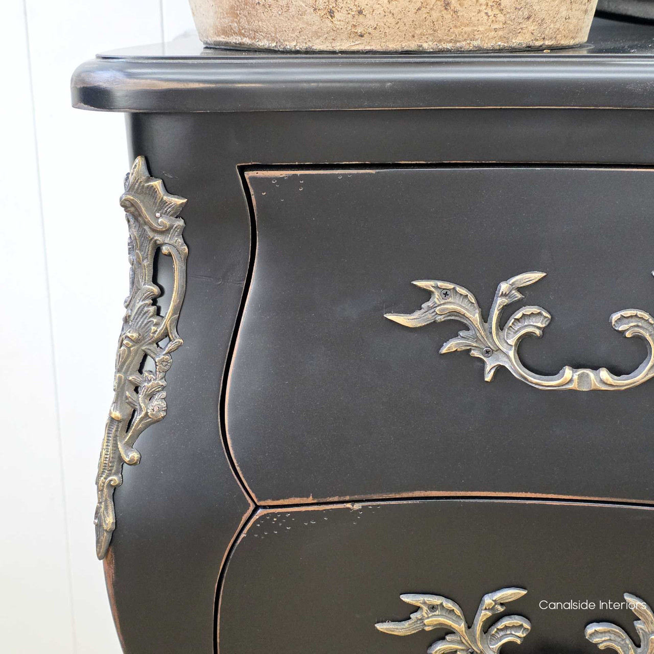 Zoom-in on the drawer alignment and hardware pattern, revealing symmetry and refinement.