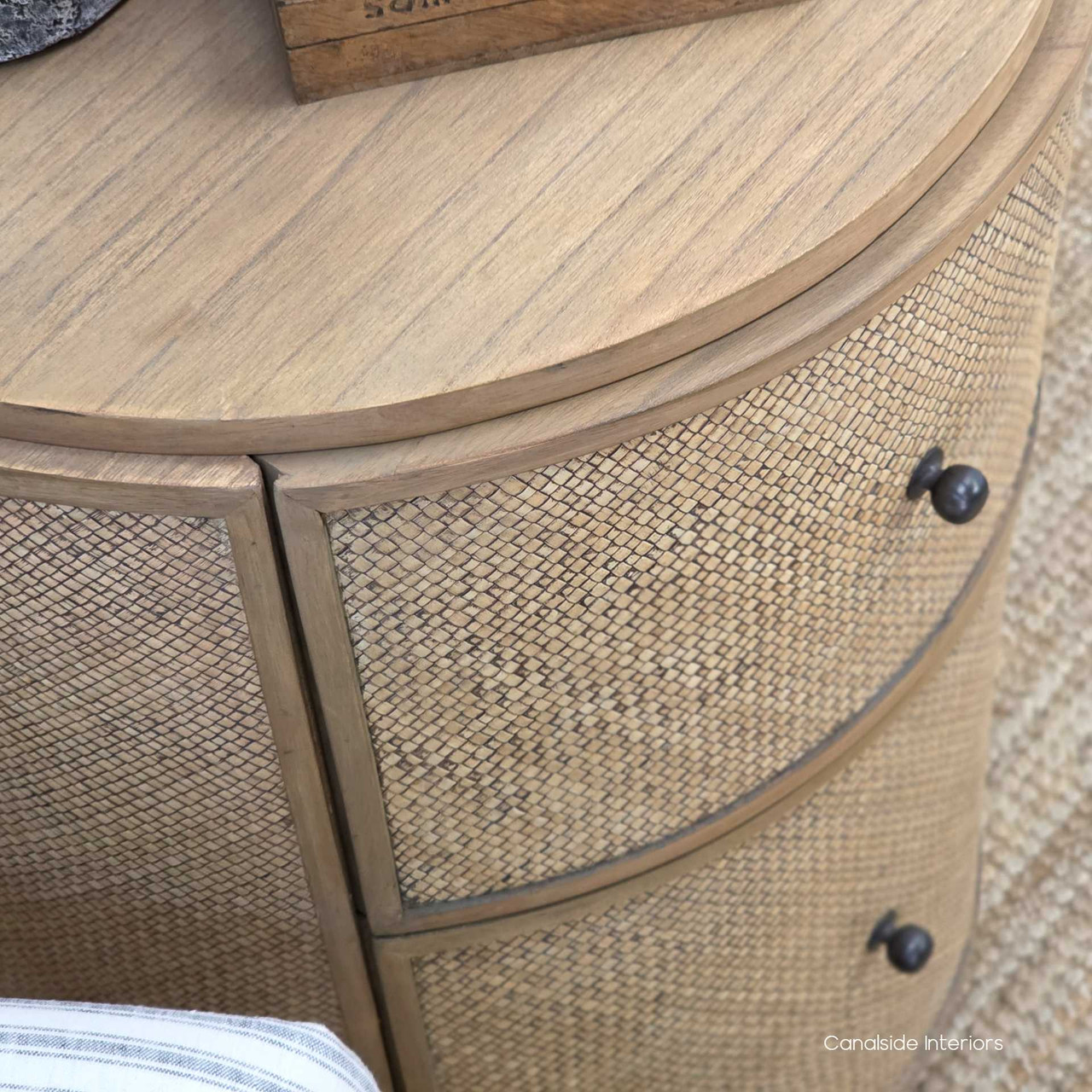 Close-up of the smooth top of the Langston Rattan Side Table, showcasing its natural beauty and durability.