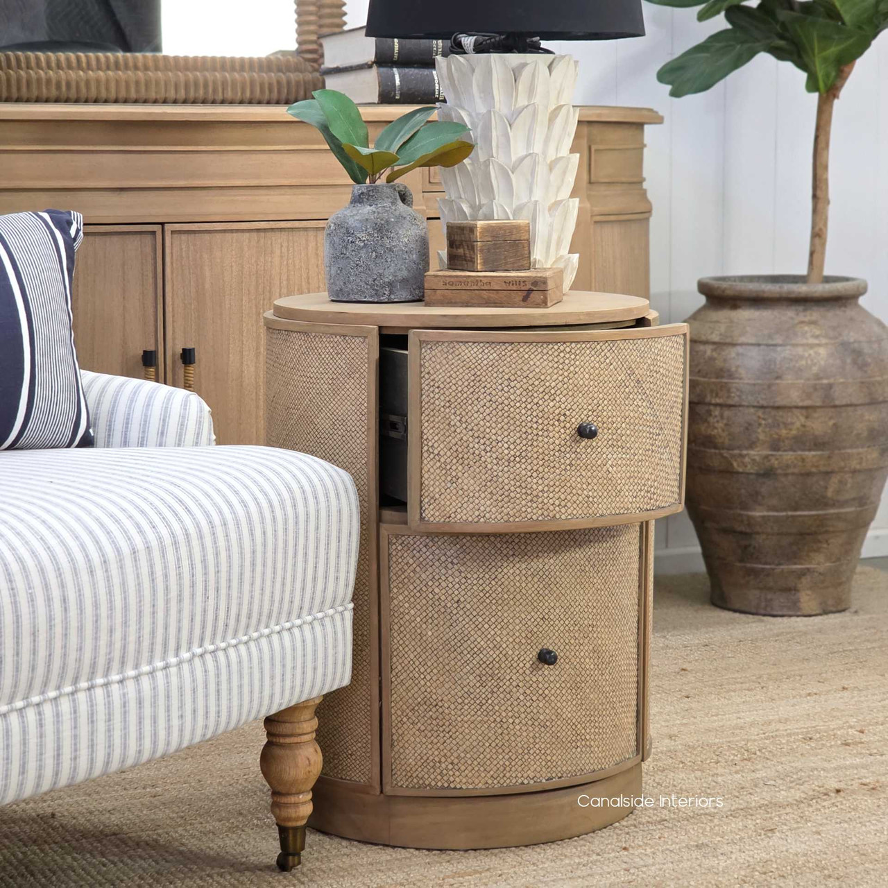 Close-up of the metal drawer runners on the Langston Rattan Side Table, showcasing the smooth, durable mechanism for effortless opening and closing.