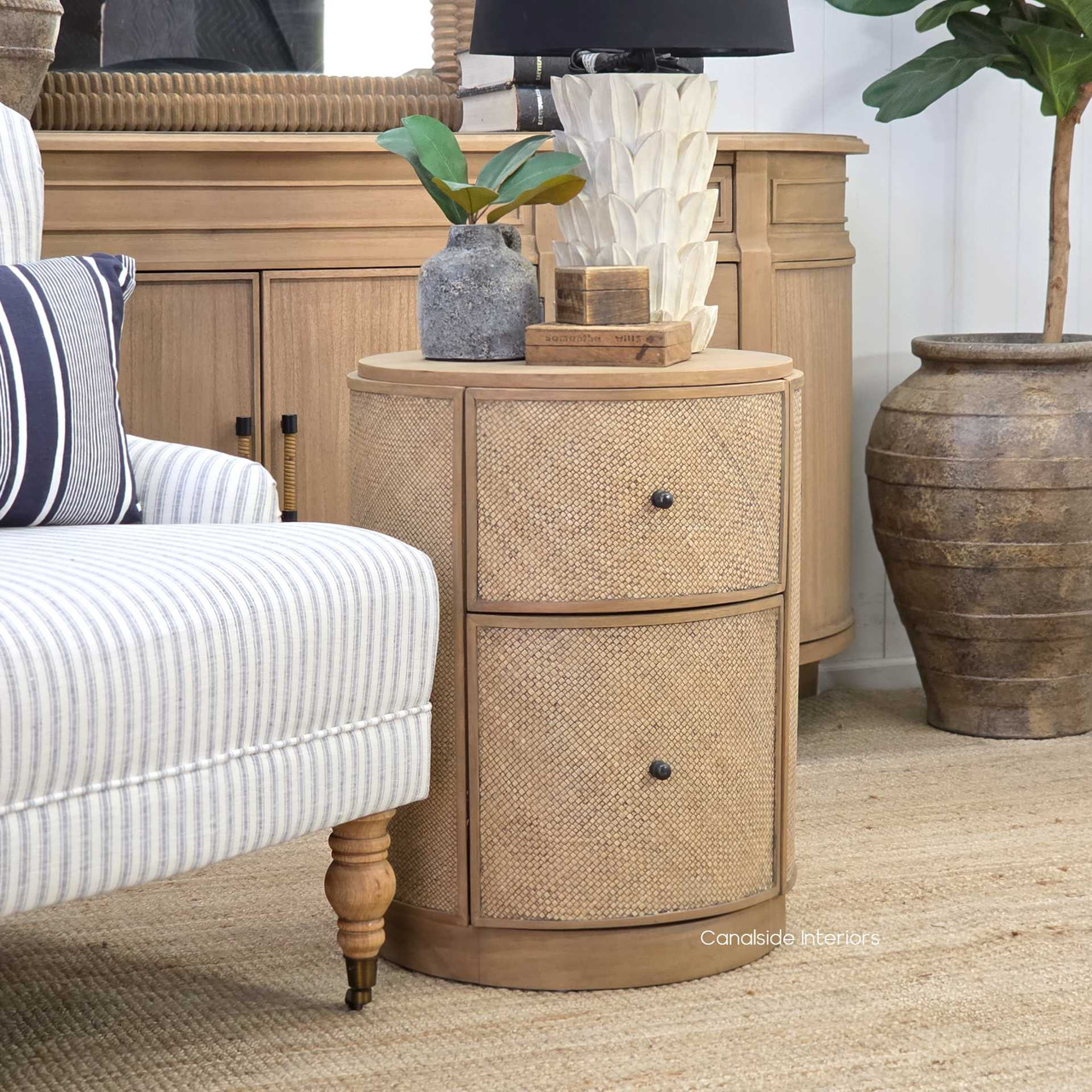 Side angle of the Langston Rattan Side Table, highlighting its bold yet refined presence and seamless craftsmanship.
