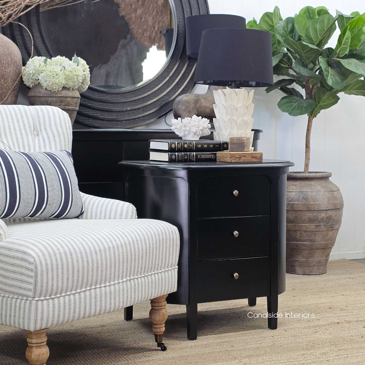 Three-quarter angled shot of the Creemore 3 Drawer Bedside in Black showing the sculpted edges and refined minimalist form