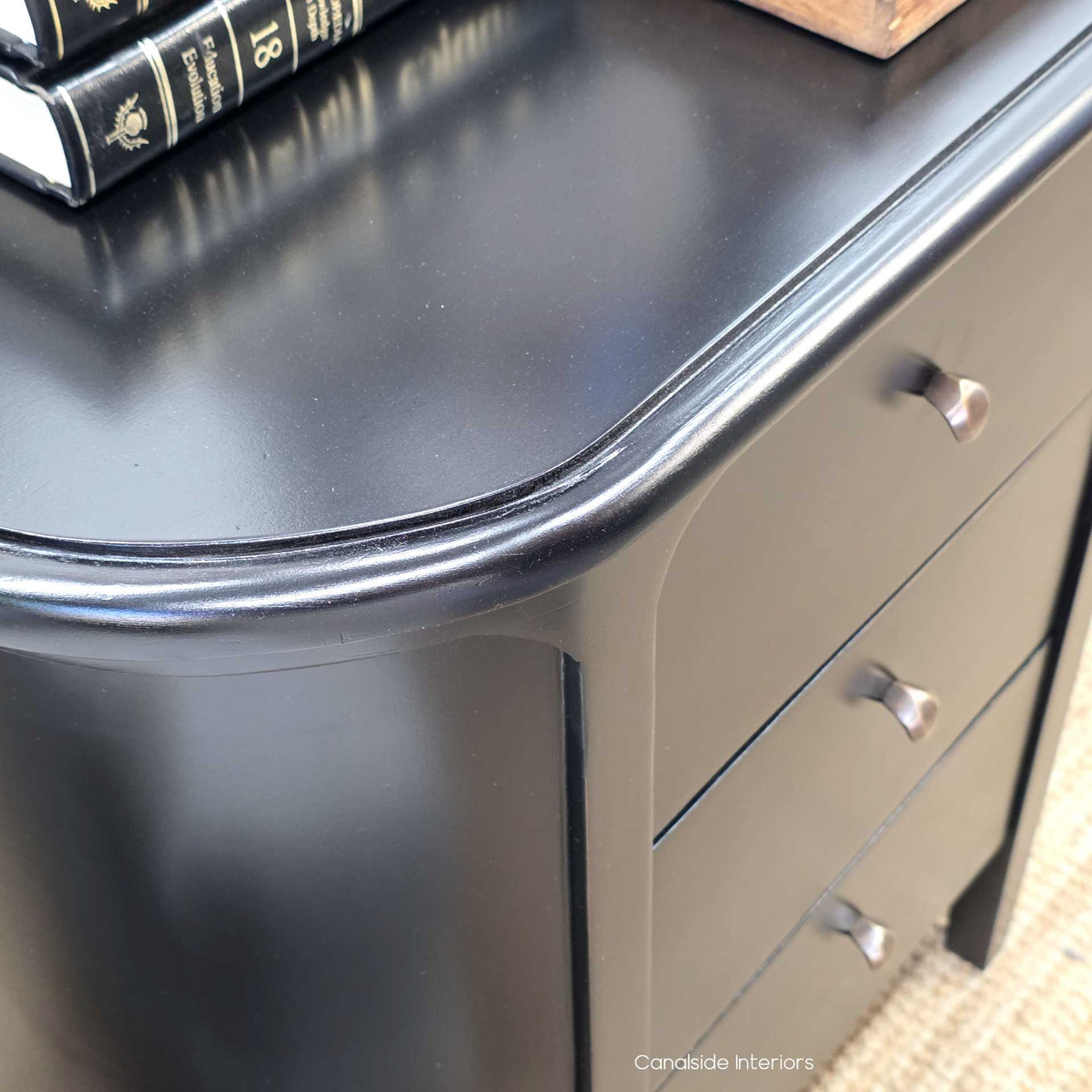 Close-up of the Creemore 3 Drawer Bedside in Black showing the rounded top edge and refined craftsmanship