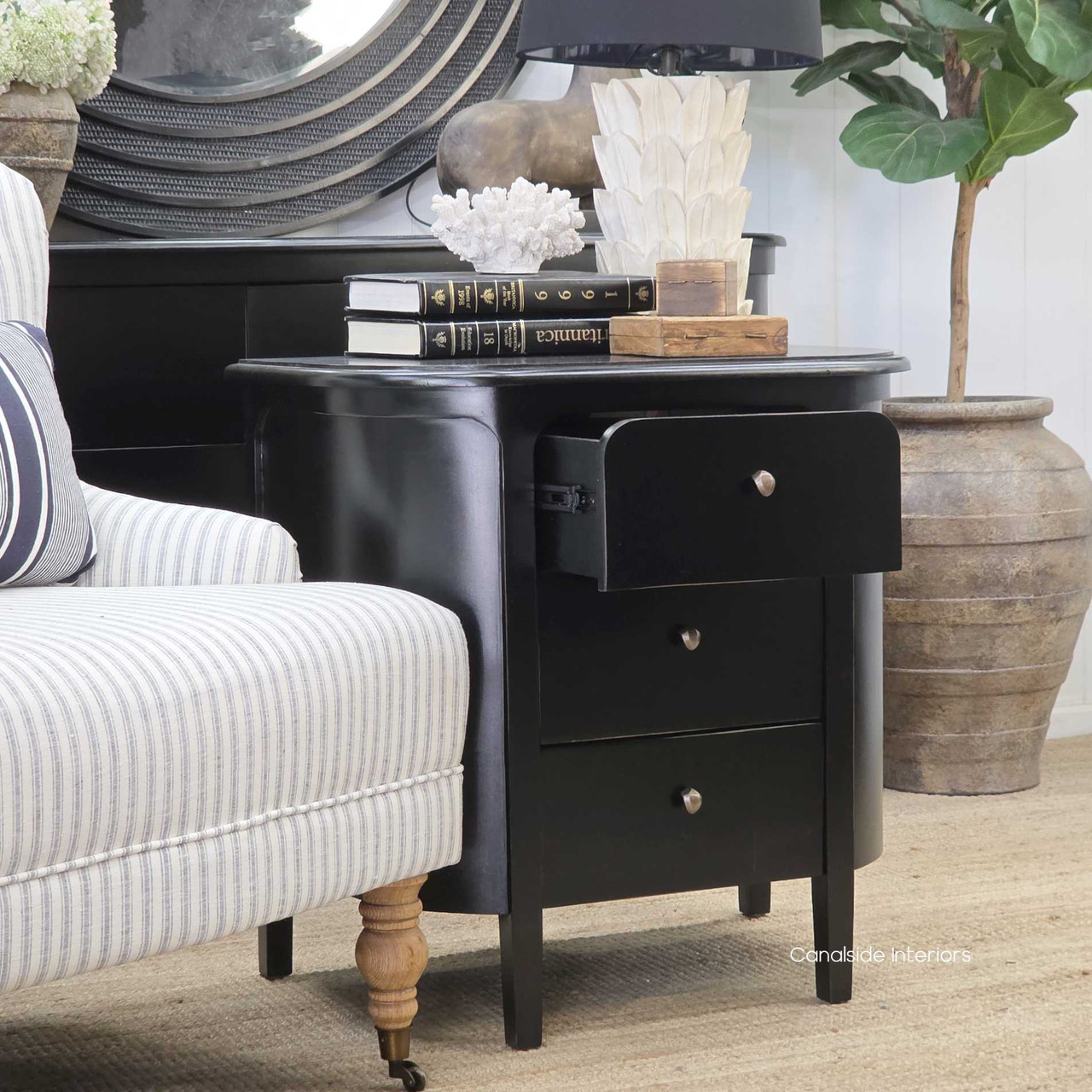 Side-angled image of the Creemore 3 Drawer Bedside in Black emphasising the recessed drawer fronts and soft rounded corners with drawer open