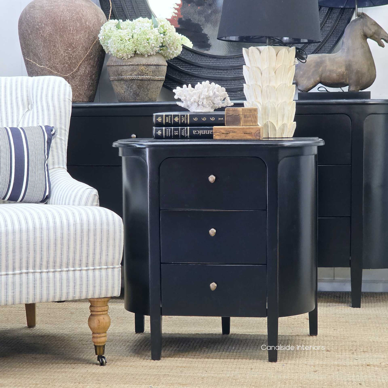 Diagonal front-angle view of the Creemore 3 Drawer Bedside in Black capturing the depth, proportion and elegant simplicity of the design.