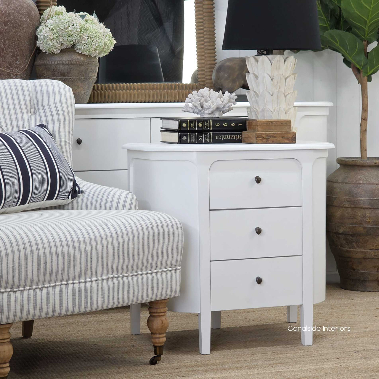 Side panel detail of the Creemore 3 Drawer Bedside in White, capturing the curved frame and fine joinery