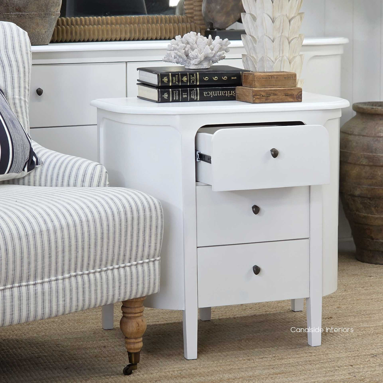 Angled view of the Creemore 3 Drawer Bedside in White with drawer open, showing the internal storage space and smooth metal runners.