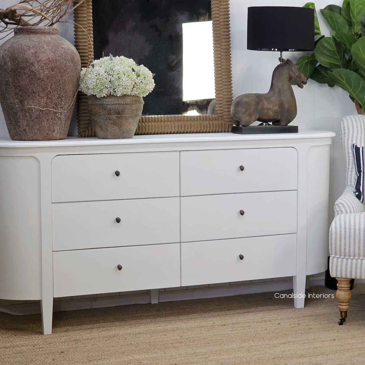 Creemore 6 Drawer Chest in White styled with décor accents and artwork, showing its versatility in modern and classic interiors.