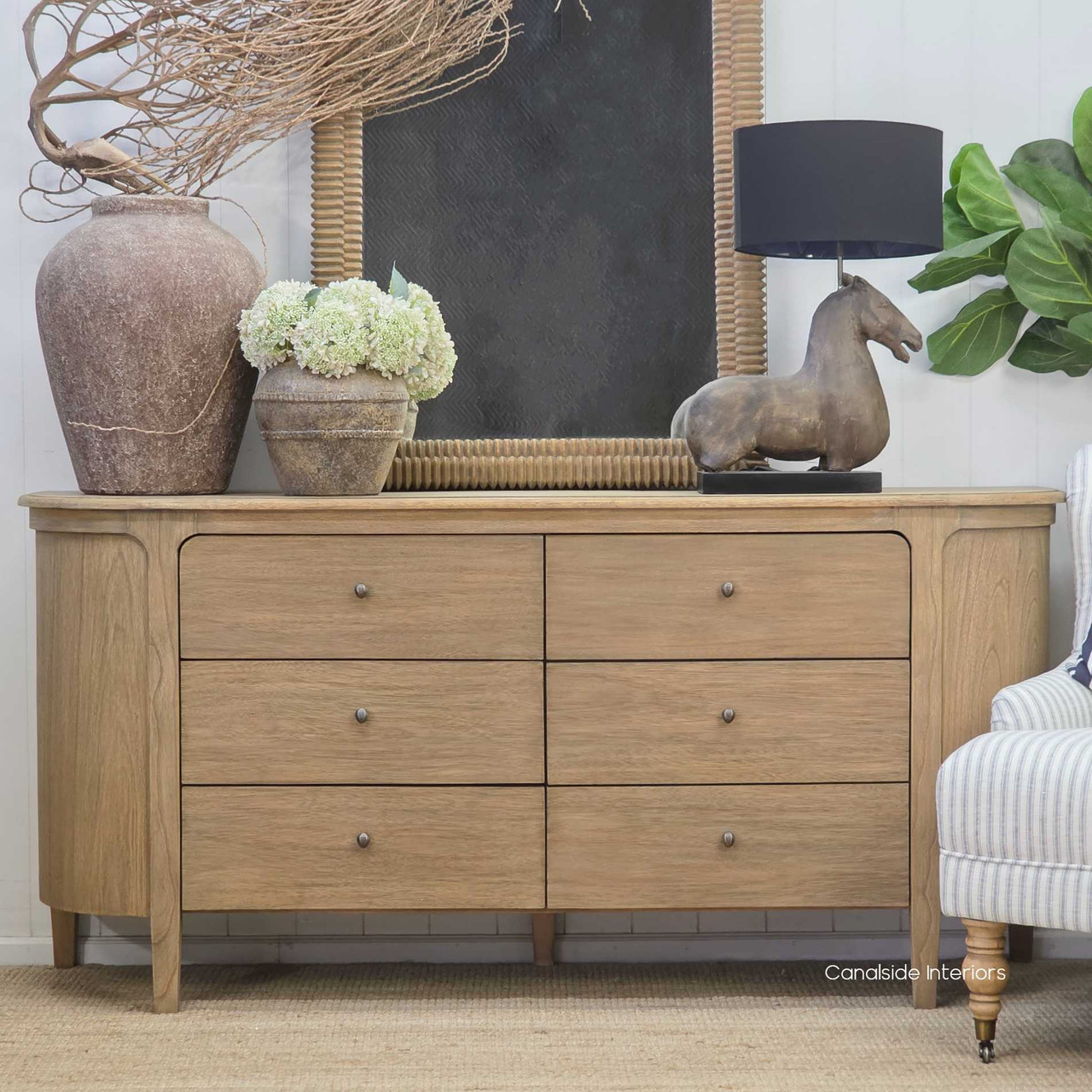 Straight-on image of the Creemore 6 Drawer Chest, highlighting the smooth Weathered Oak finish and minimalist round metal knobs.