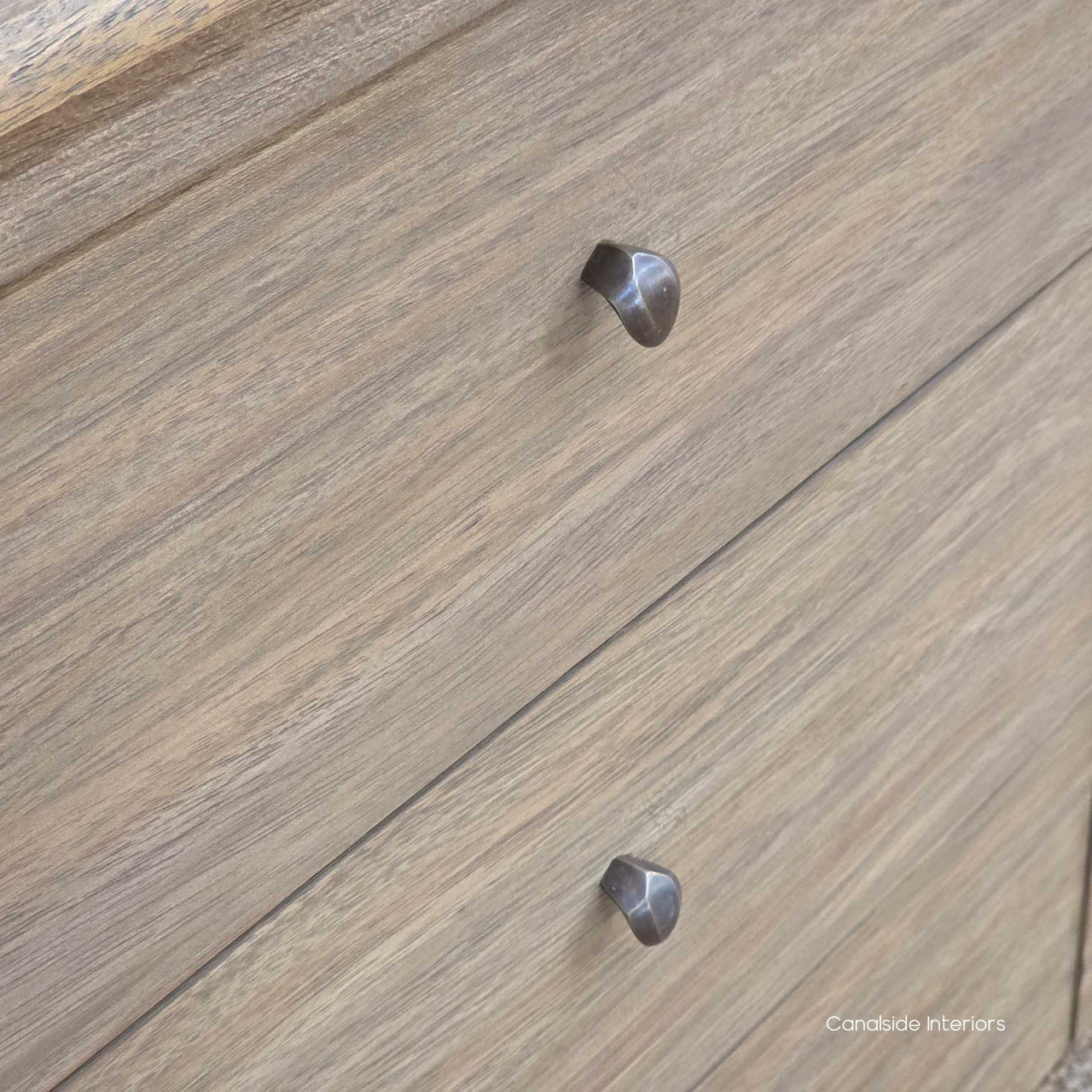 Drawer-front close-up of the Creemore 6 Drawer Chest, highlighting the smooth timber finish and simple metal knob detail.