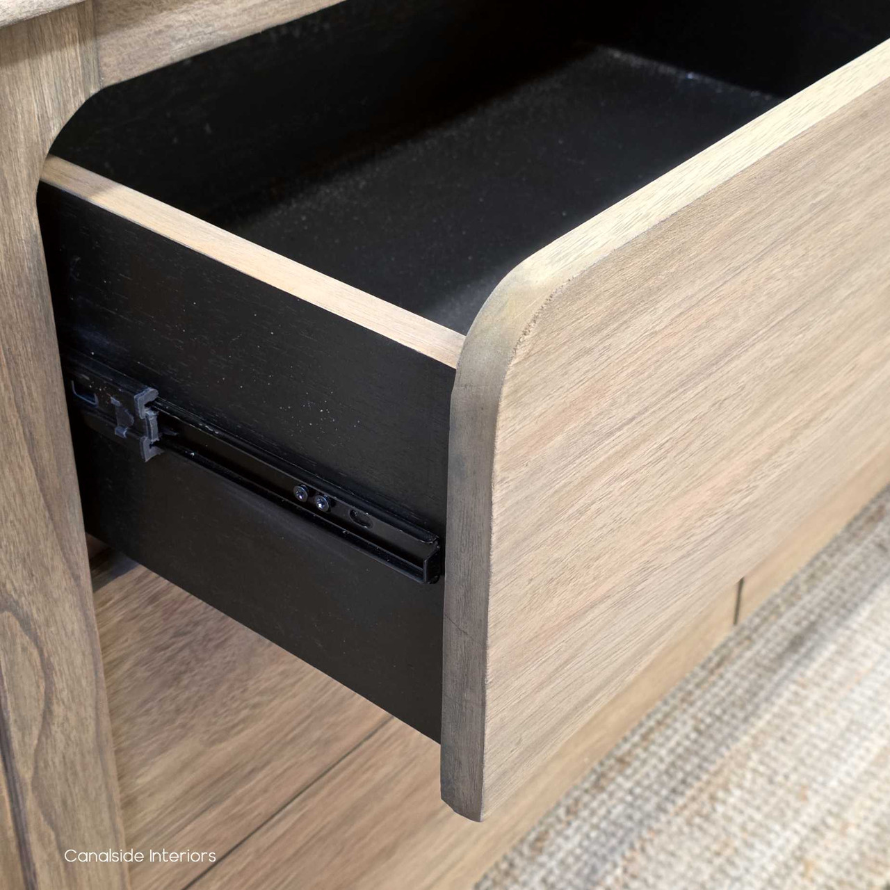 Image of the chest with a drawer partially open, displaying the interior storage capacity and smooth glide function.