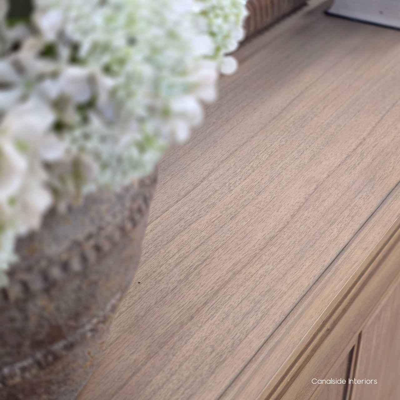 Close-up of the Riverview Buffet top surface in weathered oak, showing tonal variation and grain detail.