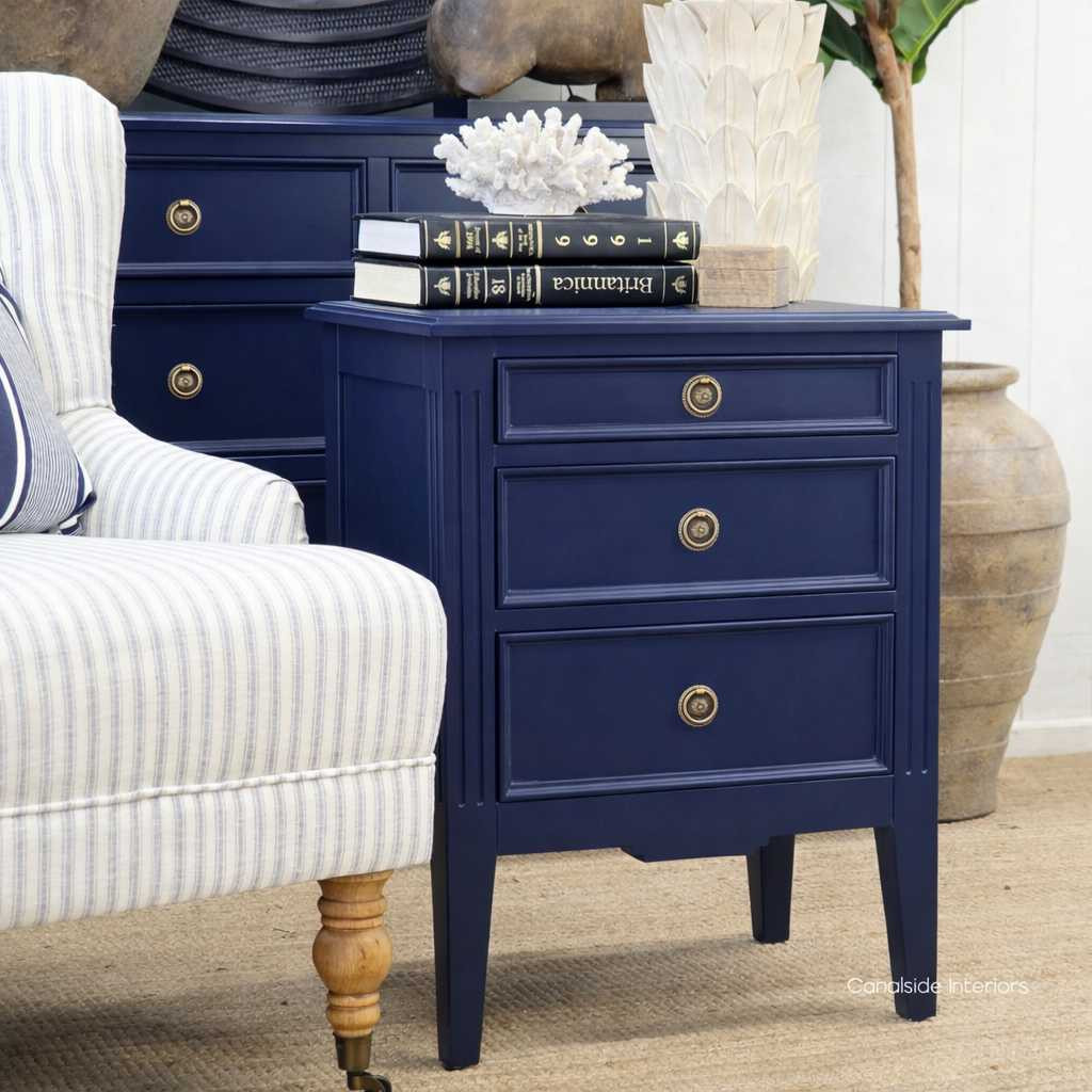 Angled view of the Elegant Peninsula Bedside Table featuring a Navy Blue  finish, perfect for adding coastal charm to any bedroom.