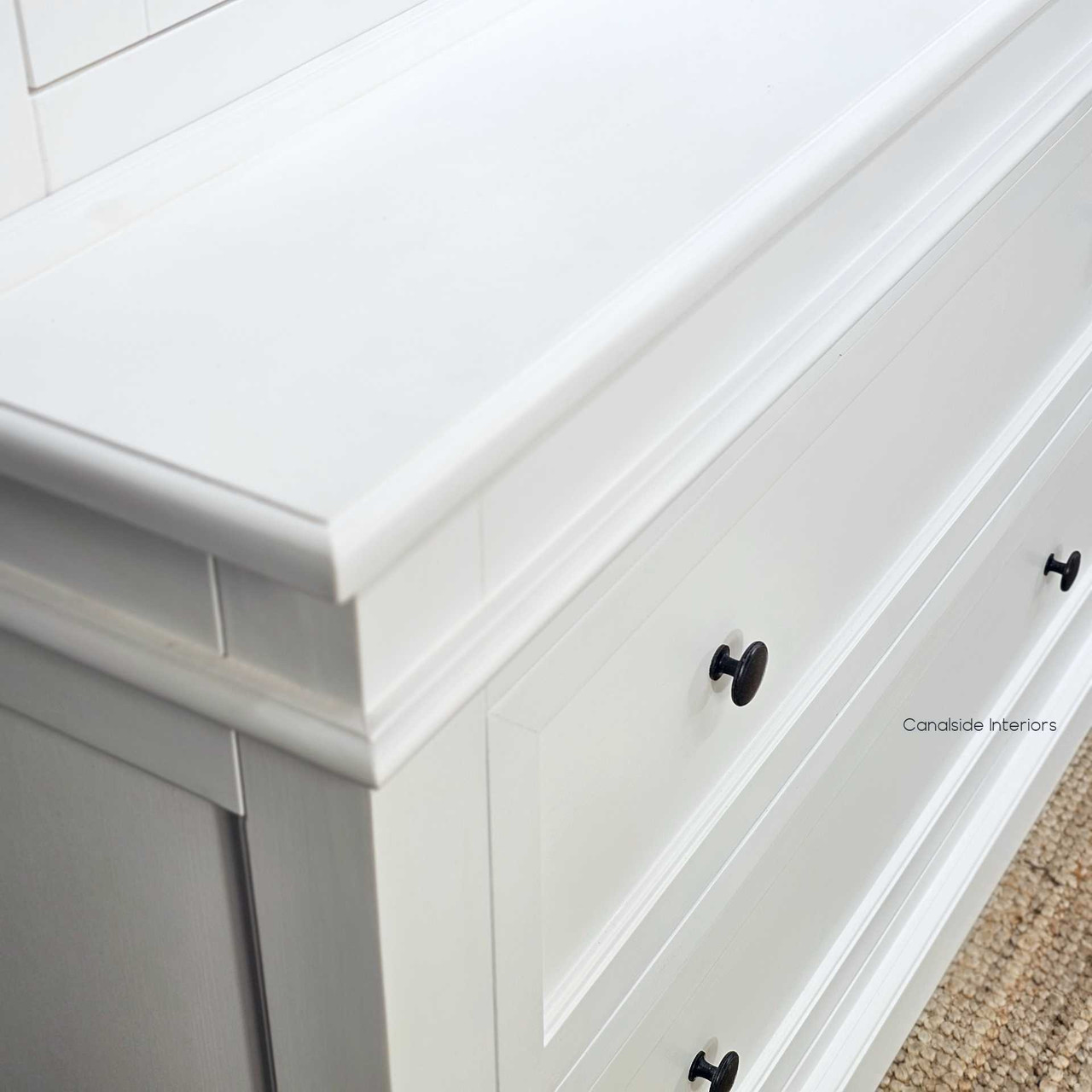 Positioned on a jute rug with light-toned floors to show integration in casual interiors and a focus on the base moulding