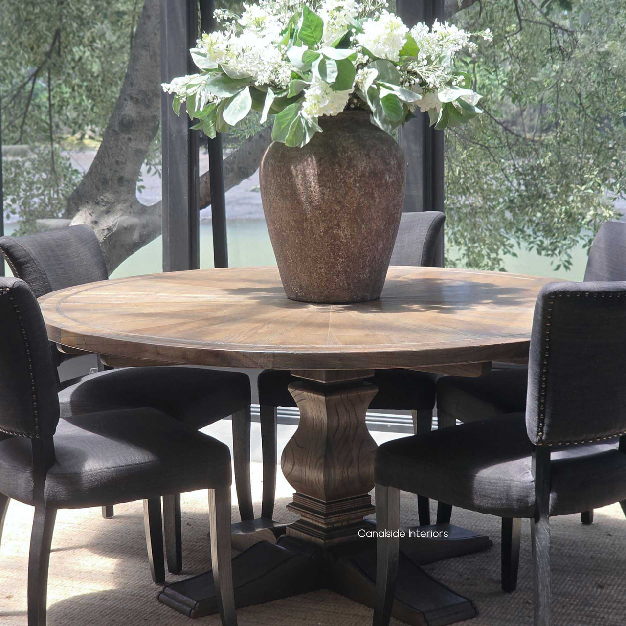Hand-crafted oak pedestal base of the Danbury table, designed for elegant dining and generous legroom.