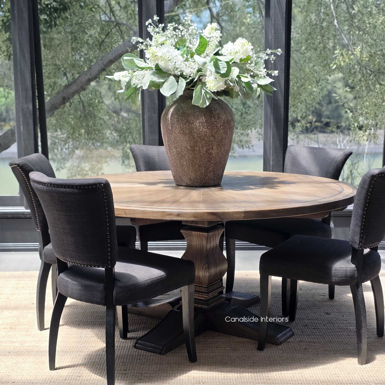 The Danbury Oak Parquetry Table in Espresso, with its eye-catching round design, brings a sophisticated focal point to both traditional and contemporary homes