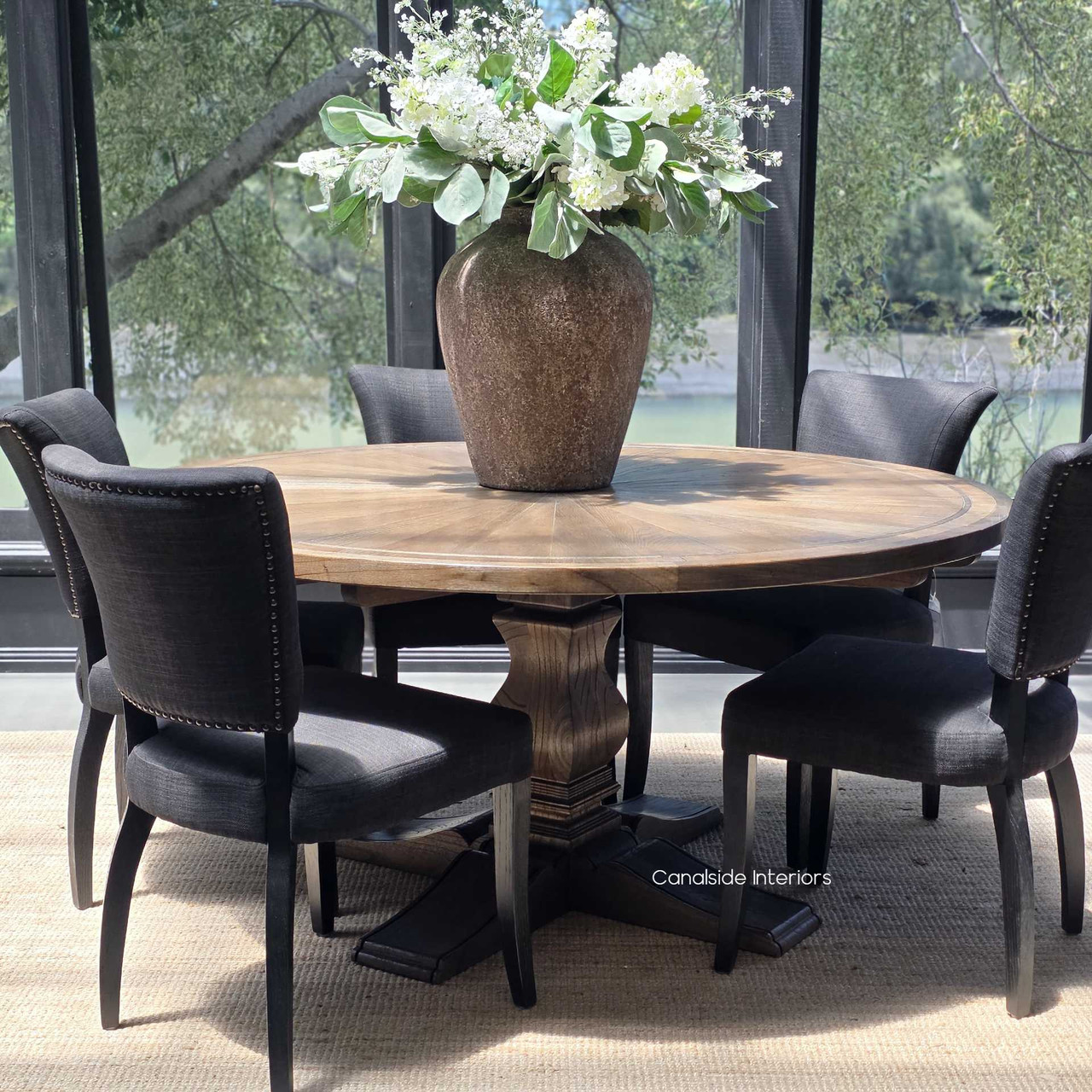 A centrepiece of craftsmanship, the Danbury Oak Parquetry Round Dining Table boasts a timeless espresso finish, perfect for Hamptons-inspired dining rooms - Canalside Interiors Sydney.