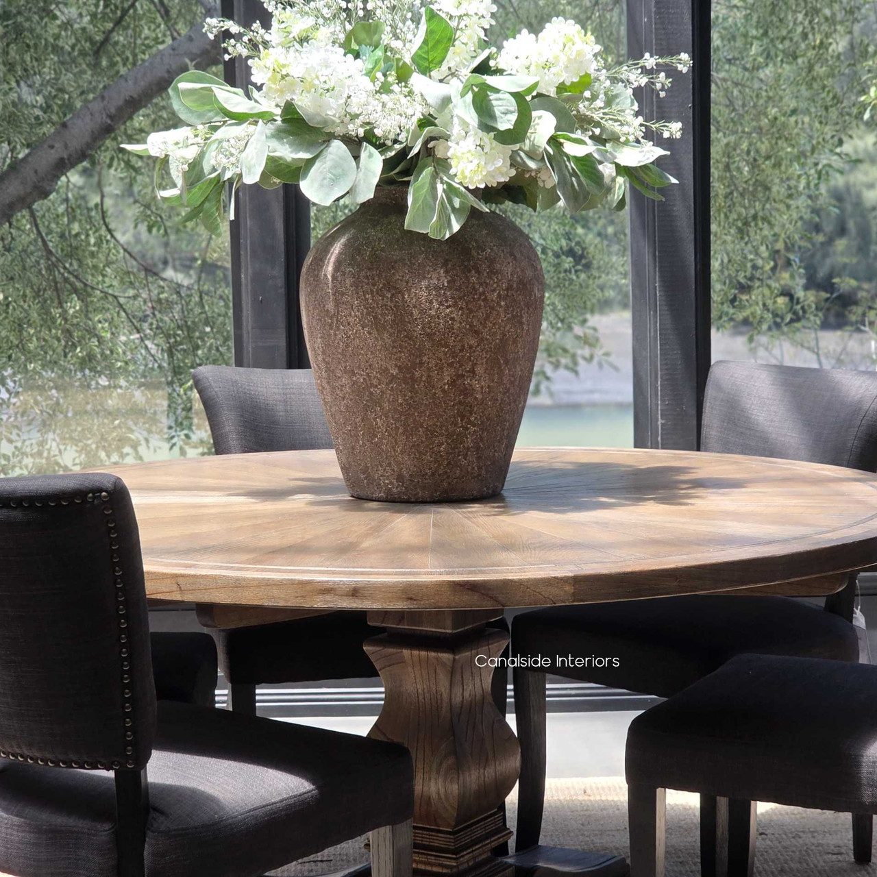Meticulously handcrafted, the Danbury Oak Round Table in Espresso anchors your dining space with its robust pedestal and rich oak textures, embodying coastal luxury