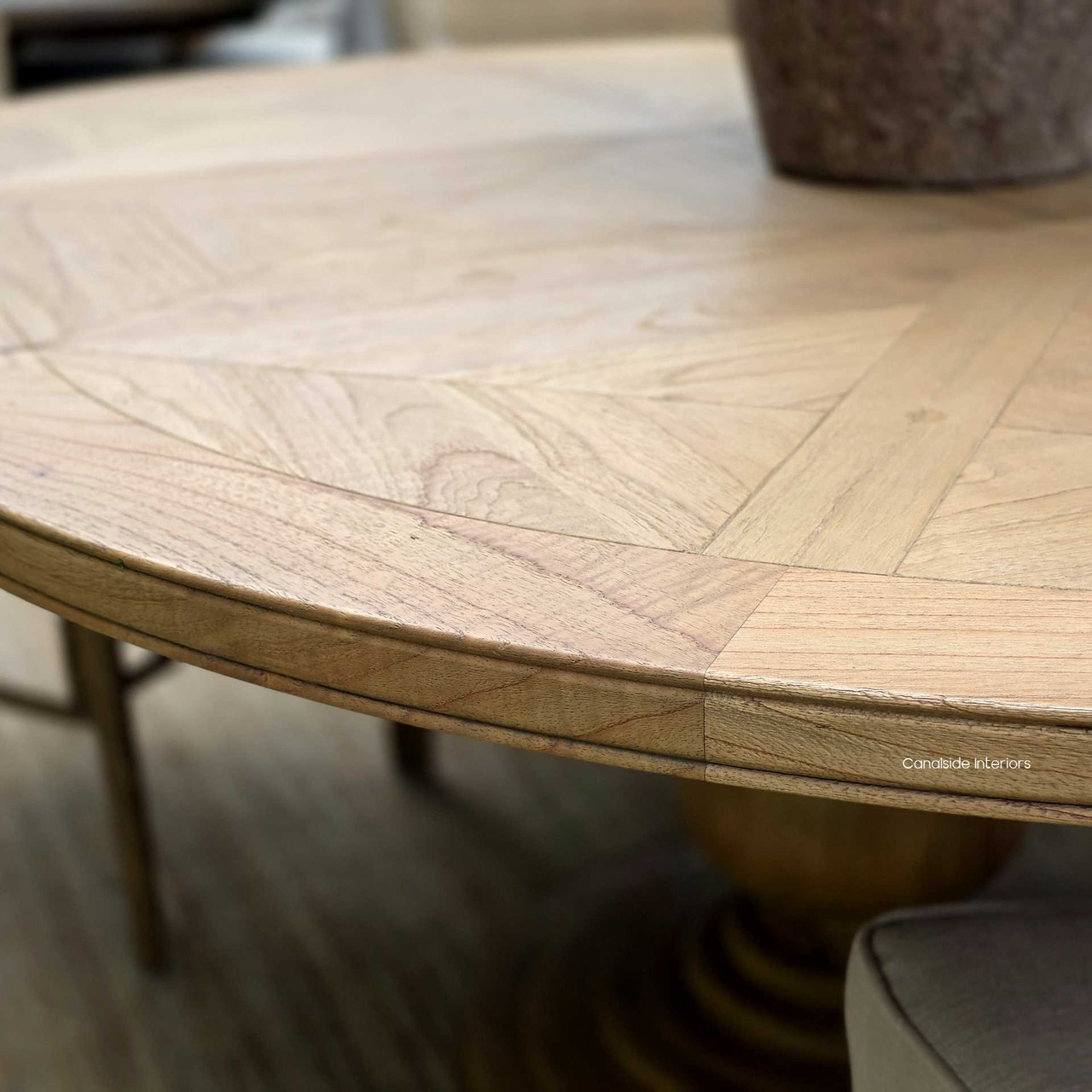 Close-up of the tabletop edge profile, showing the natural cedar finish and subtle tonal variation.