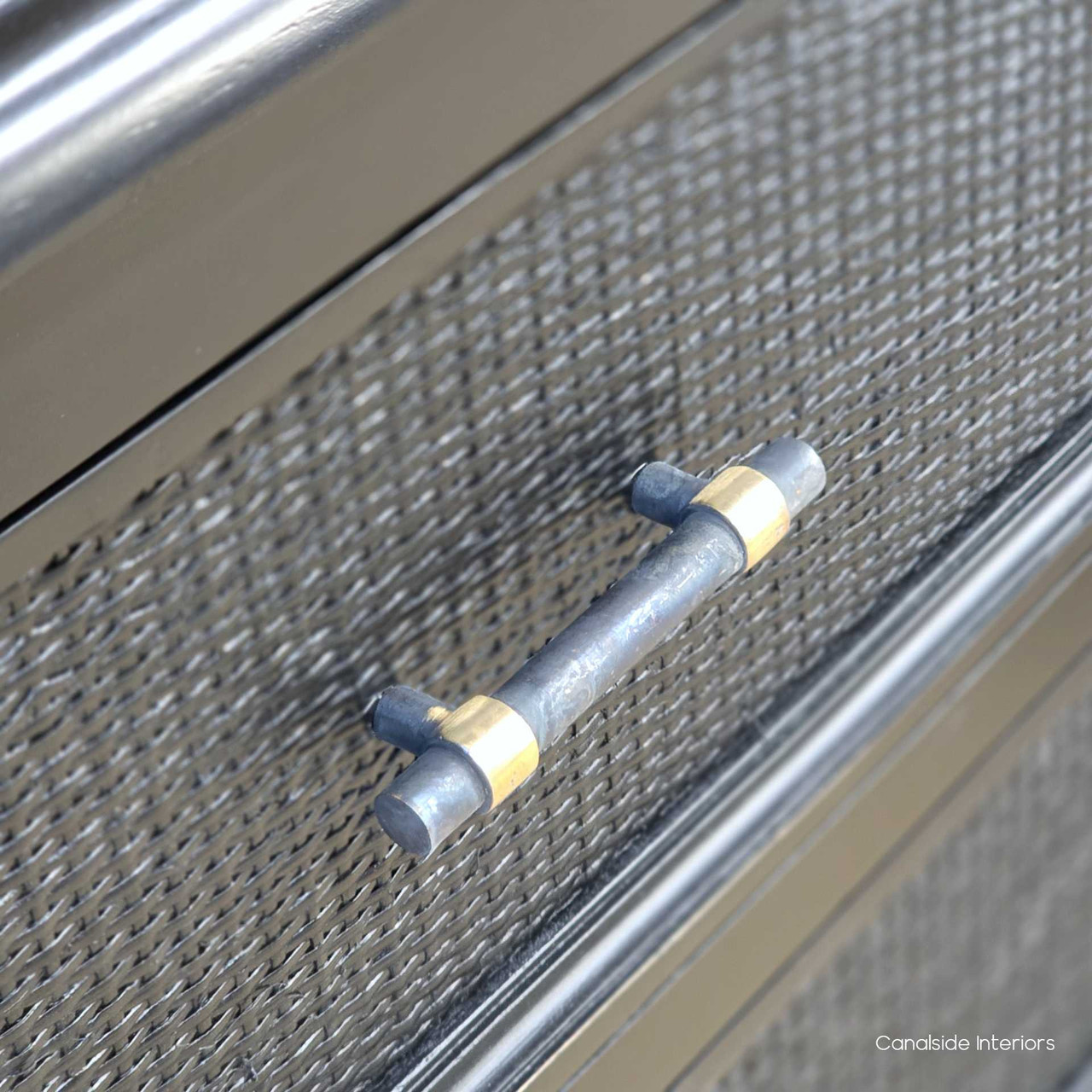 Close-up of the brass handle on the Brielle Rattan 6 Drawer Chest – Black highlighting the contrast between metal hardware and textured rattan.