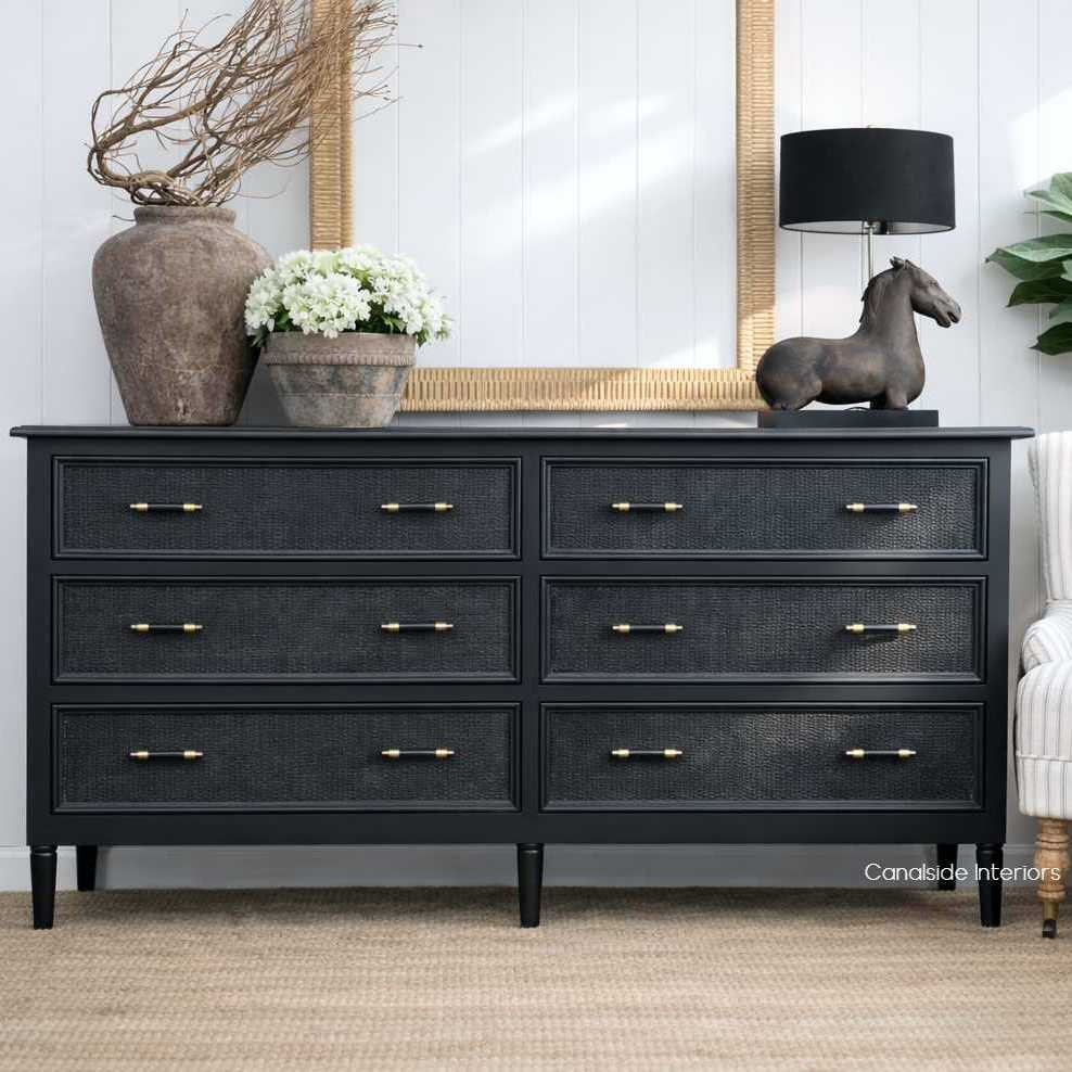 Front view of the Brielle Rattan 6 Drawer Chest in Black showing the fine woven rattan detailing and brass hardware on the drawer front.