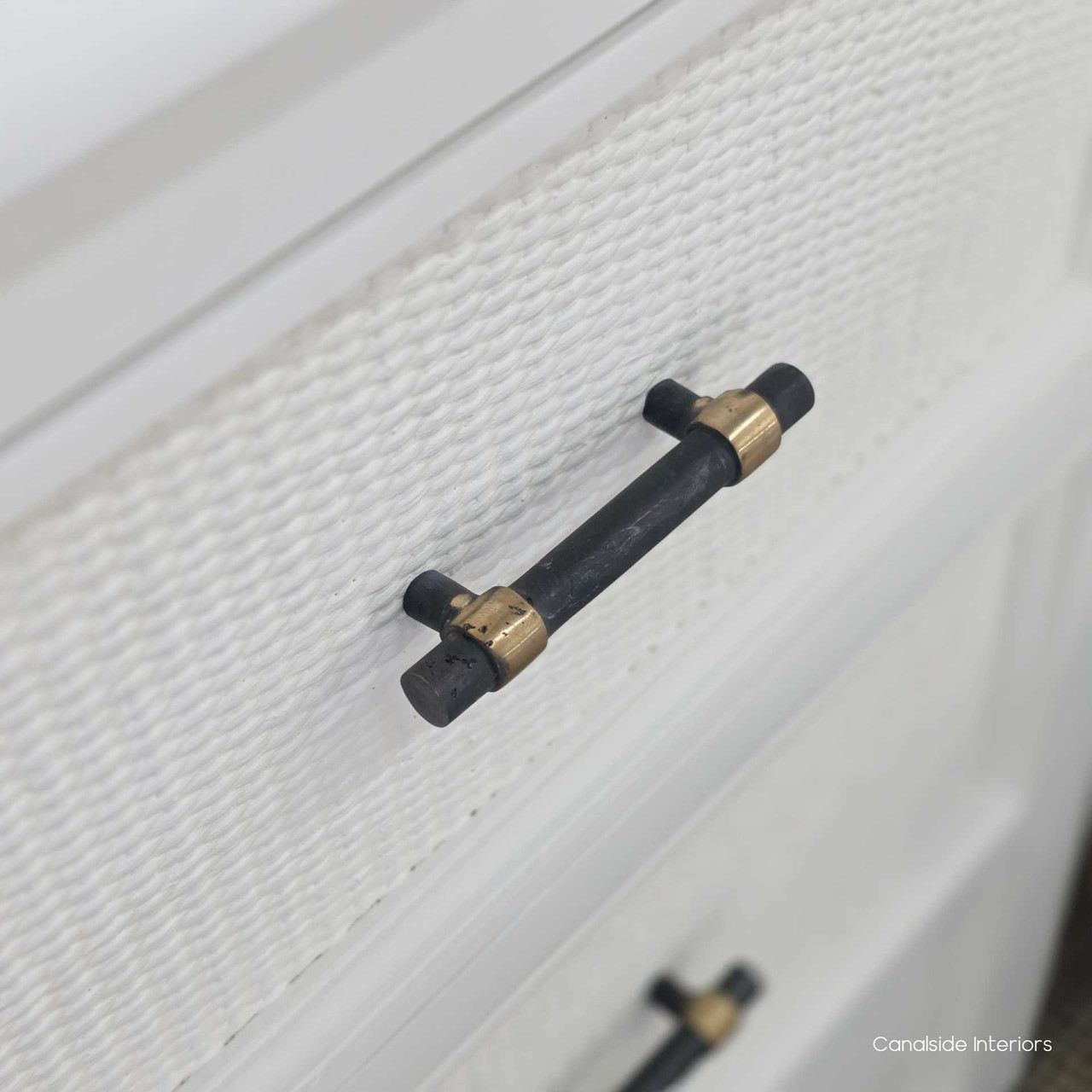 Close-up of the brass handle on the Brielle Rattan 3 Drawer Chest – White highlighting the contrast between metal hardware and textured rattan.