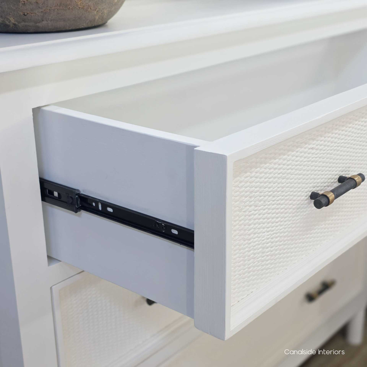Open drawer view of the Brielle Rattan 3 Drawer Chest in white showing the metal drawer runner and timber construction.