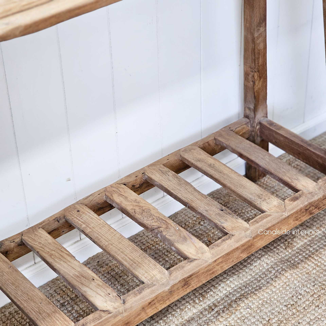 Low-angle close-up of the Vintage Teak Console’s base, highlighting its stability and well-crafted slatted joinery.