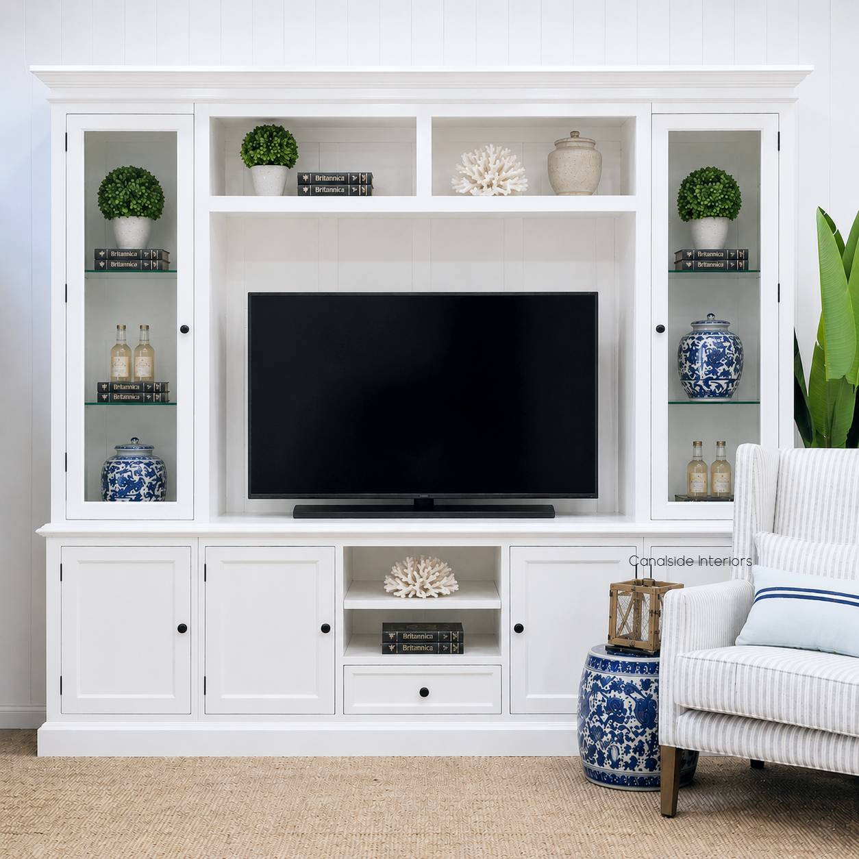Front angle of the Casement TV Media Wall Unit with Glass Door Display in white featuring glazed display doors and six lower storage cupboards, perfect for any hamptons or classic style interior