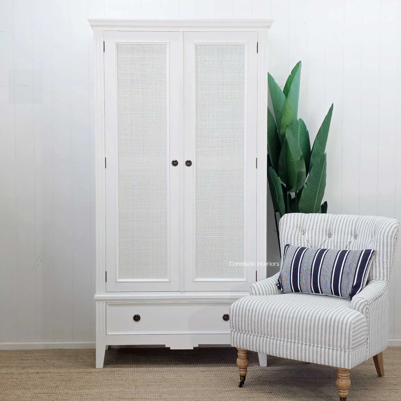 Peninsula Rattan Wardrobe in white with full height woven rattan doors and spacious lower drawer storage