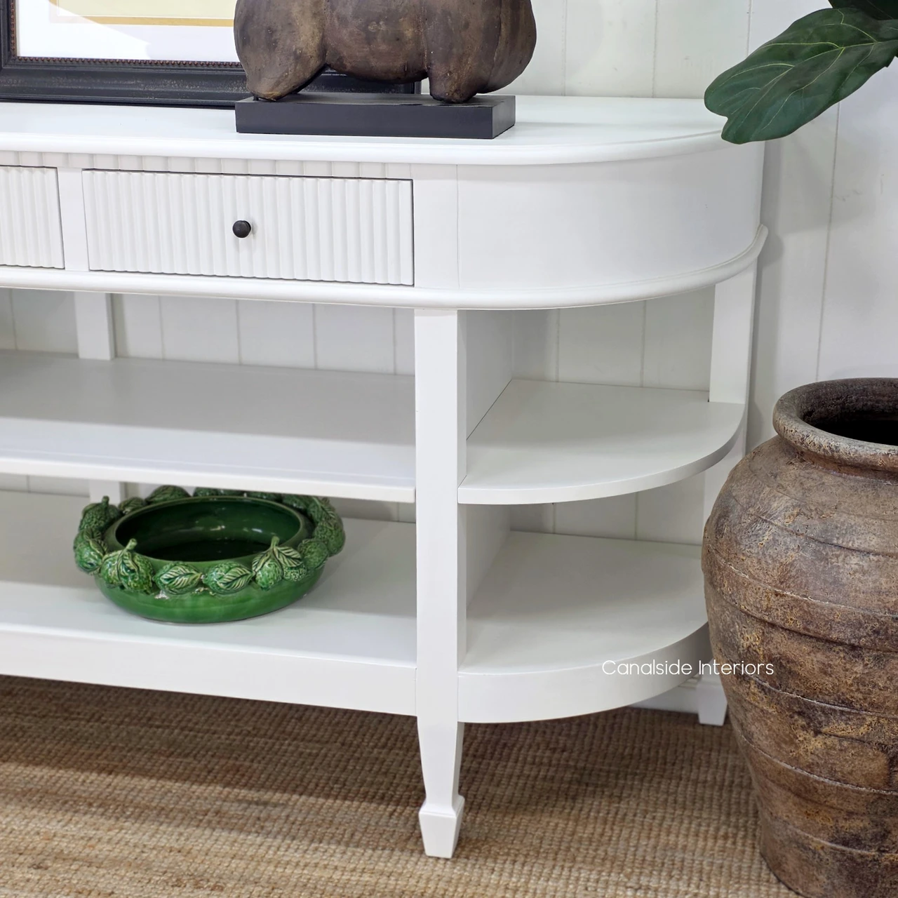 White Hamptons Console Table close-up highlighting the elegant tapered legs and classic furniture design.