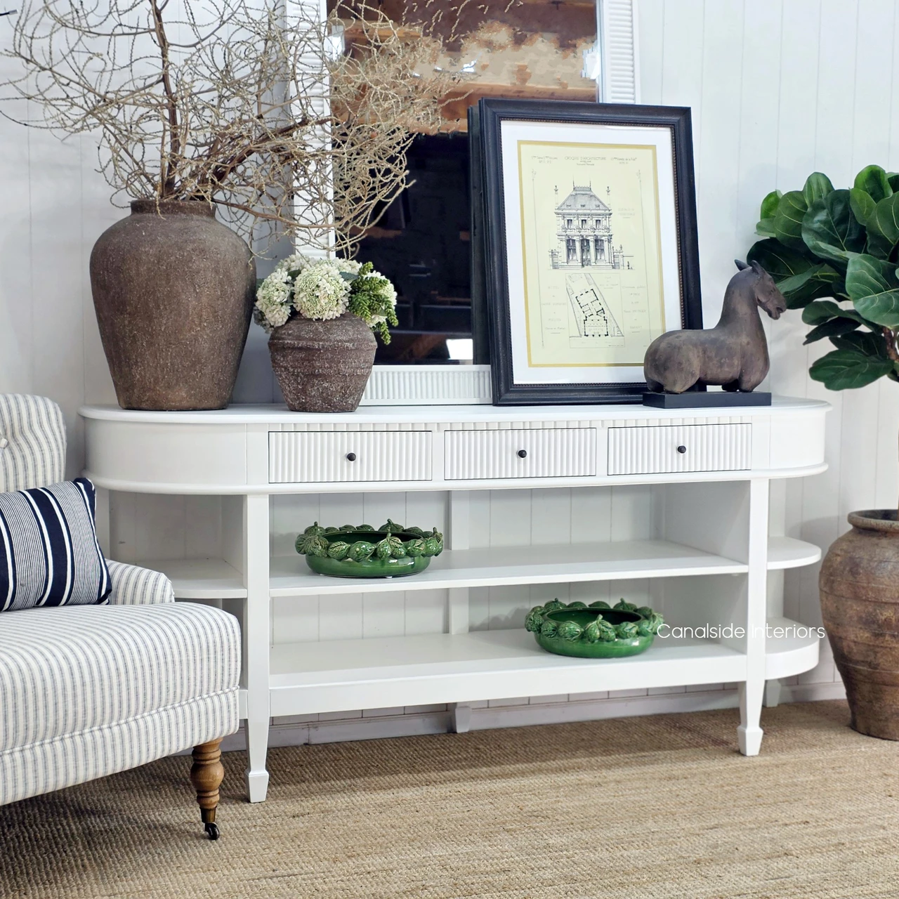 Hamptons White Console Table featuring curved side shelves, three drawers and classic tapered legs.